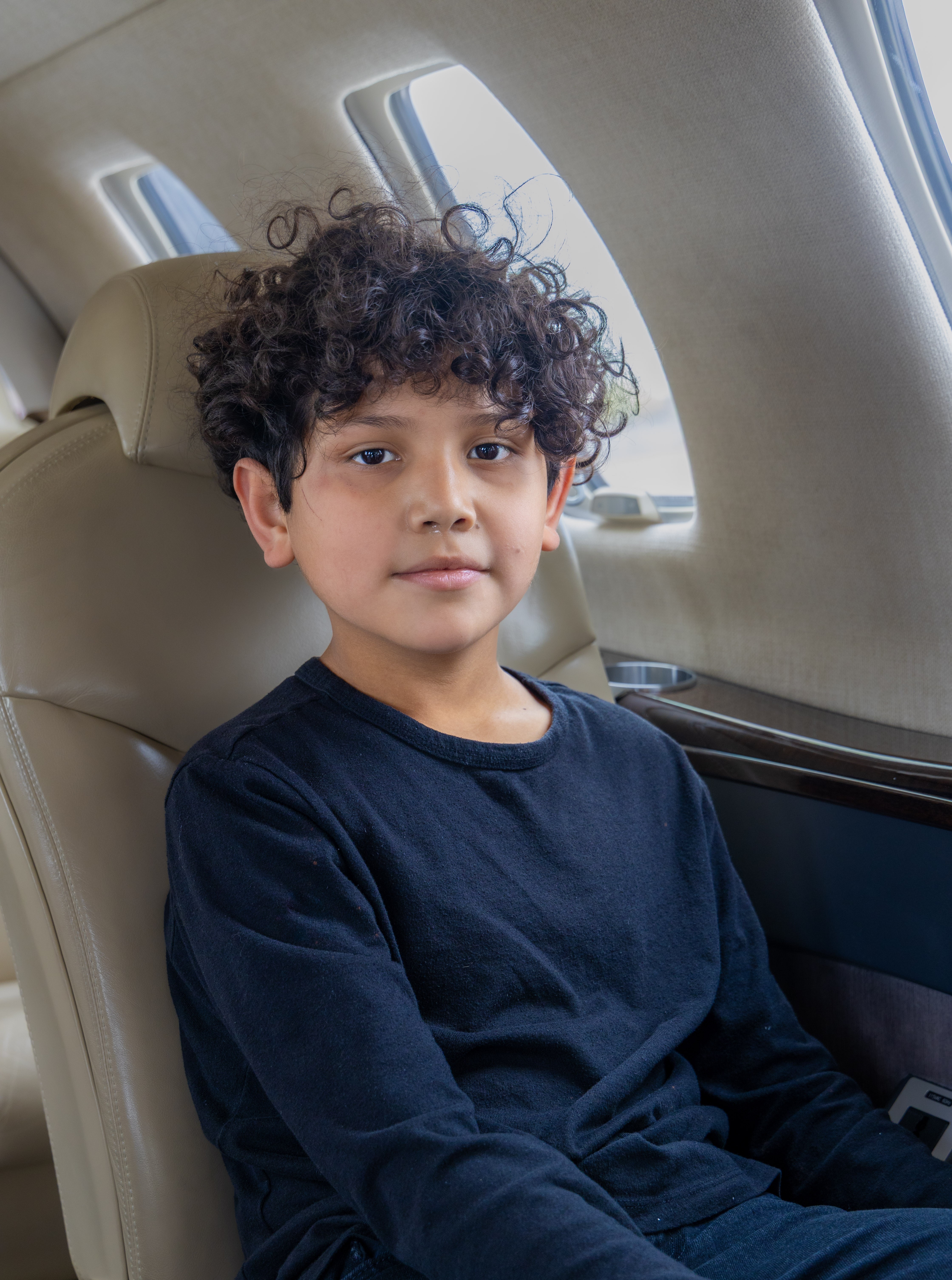 Adan sitting in jet
