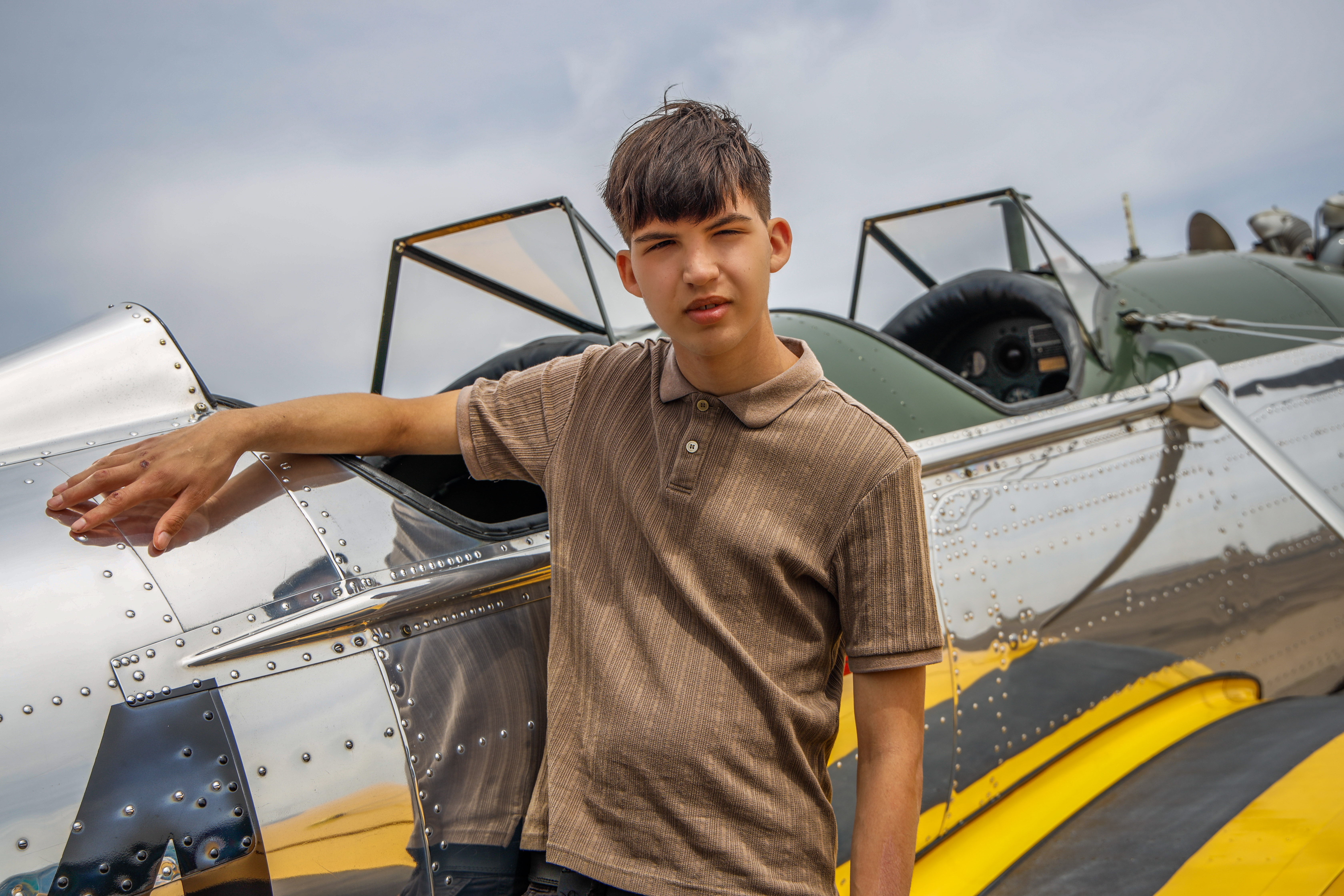 Alexander (3 standing touching plane