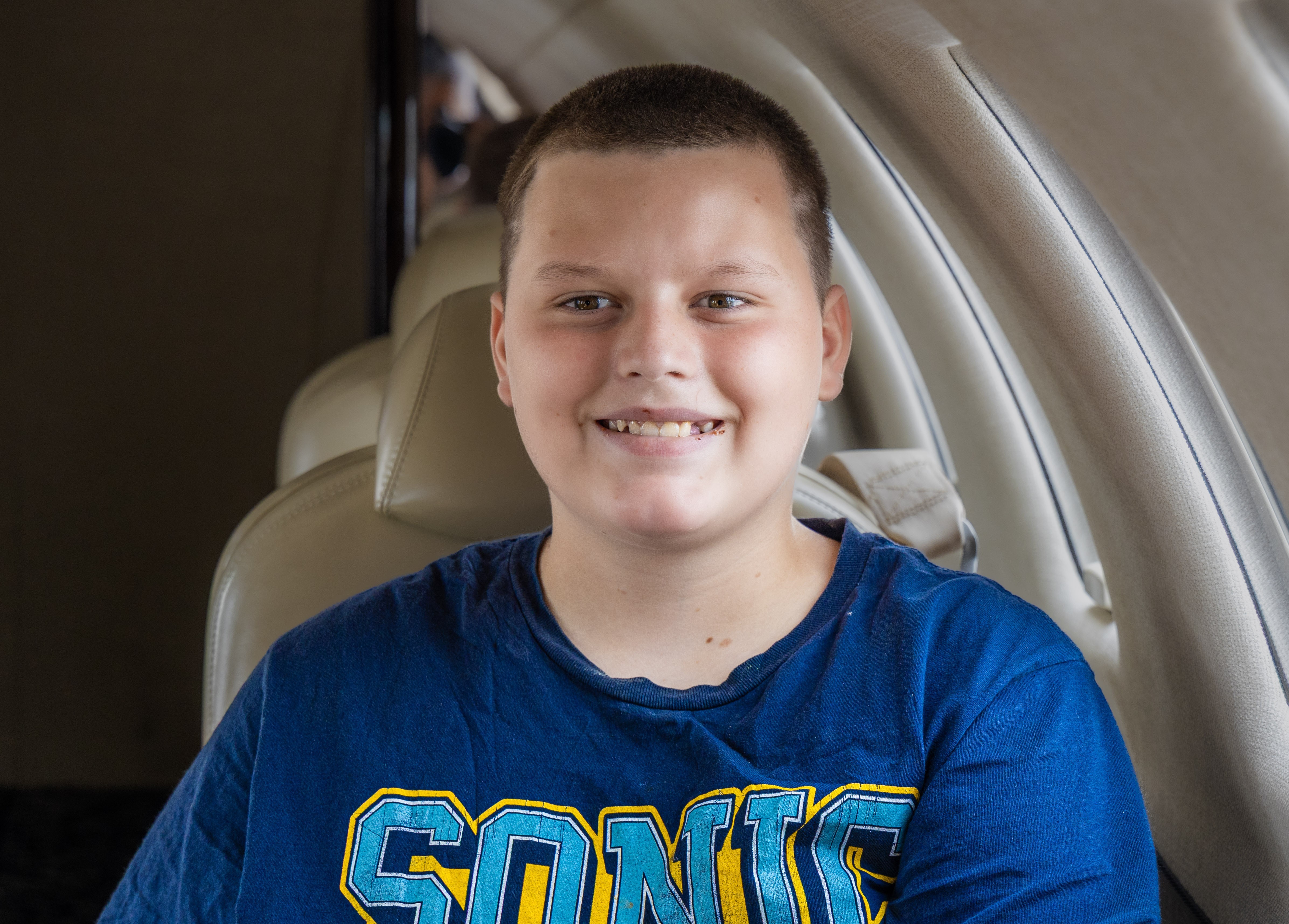 Blake sitting in jet smiling
