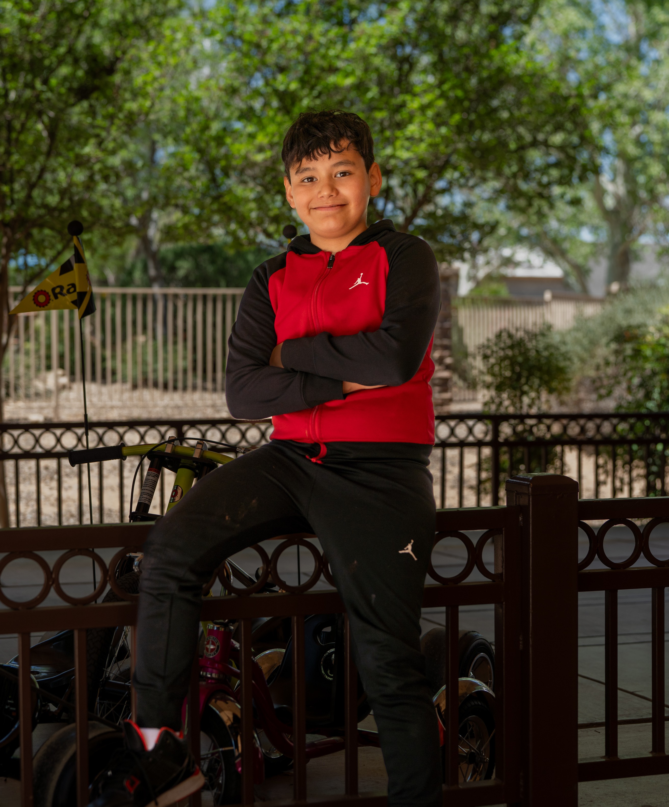 Christopher sitting on gate