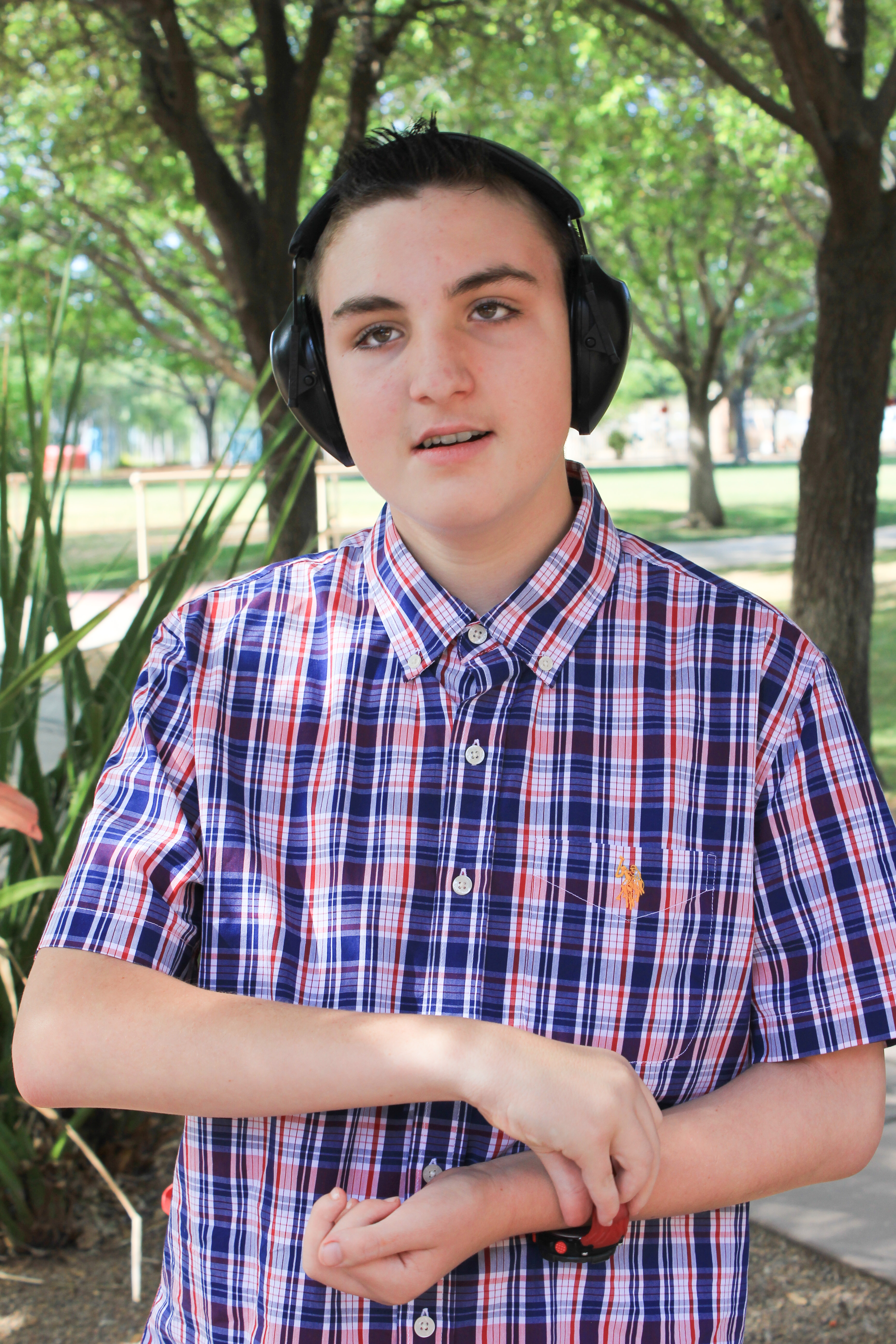 Gage half body shot trees in background