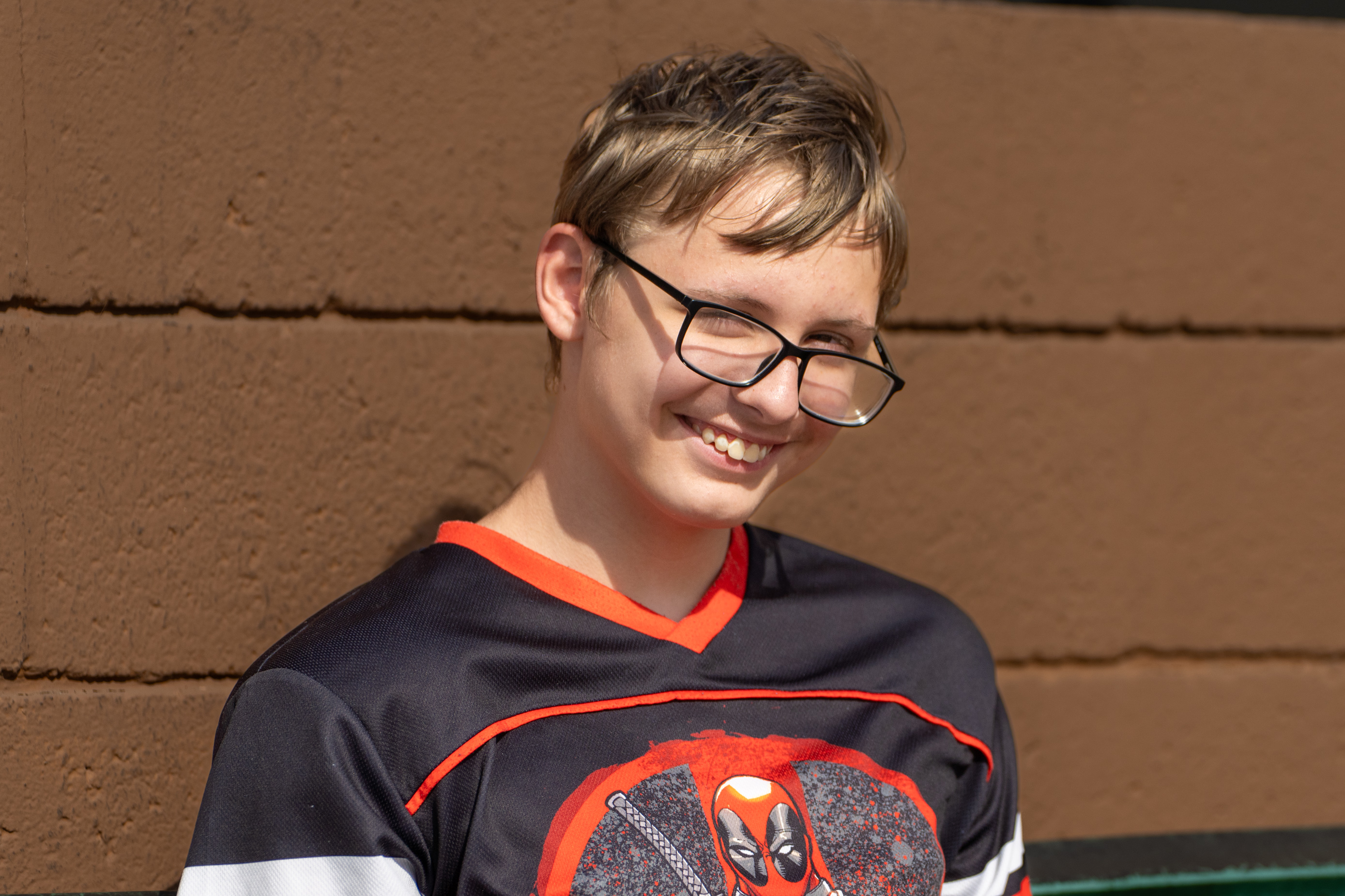 Kolby sitting brown background