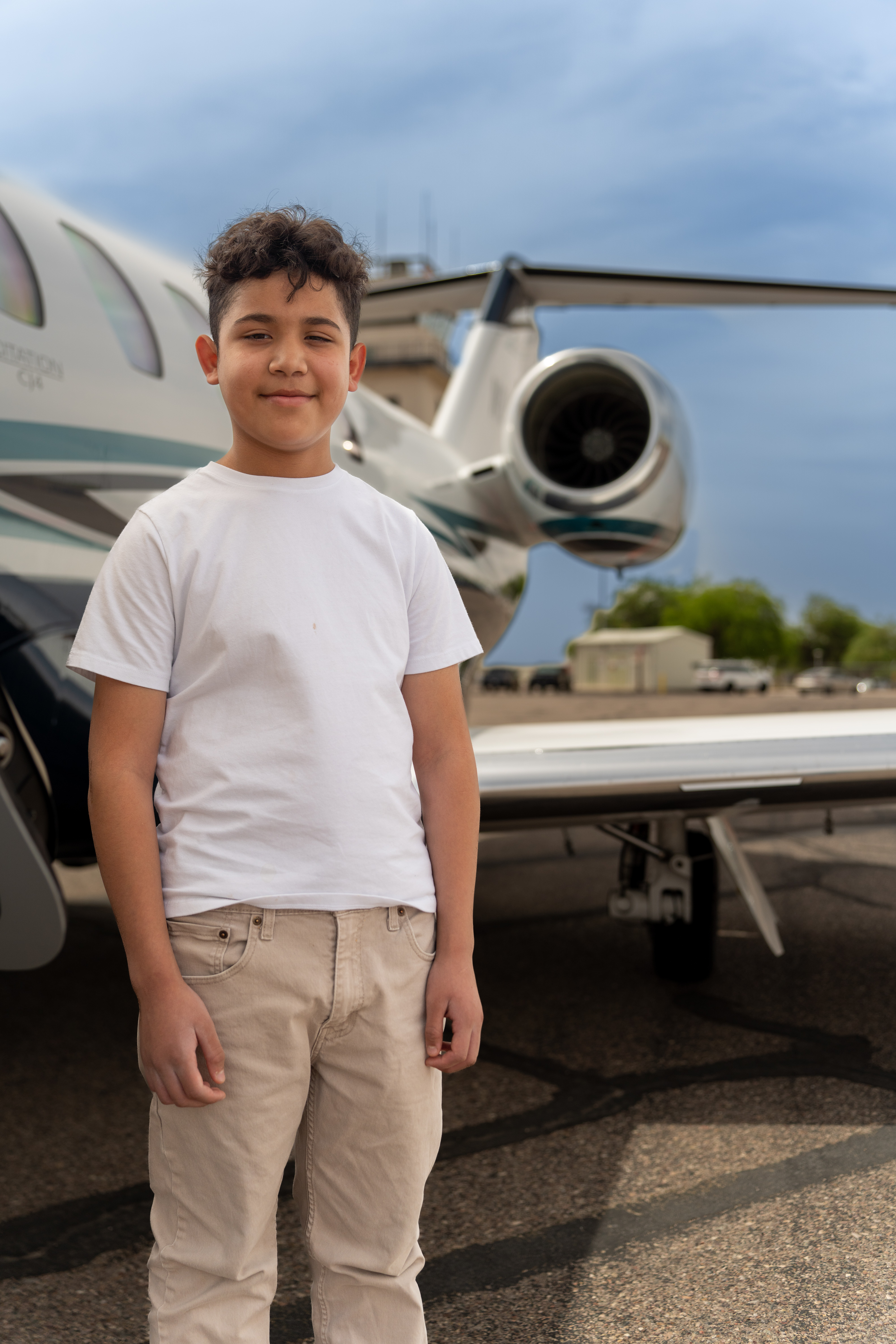 Victor standing next to plane