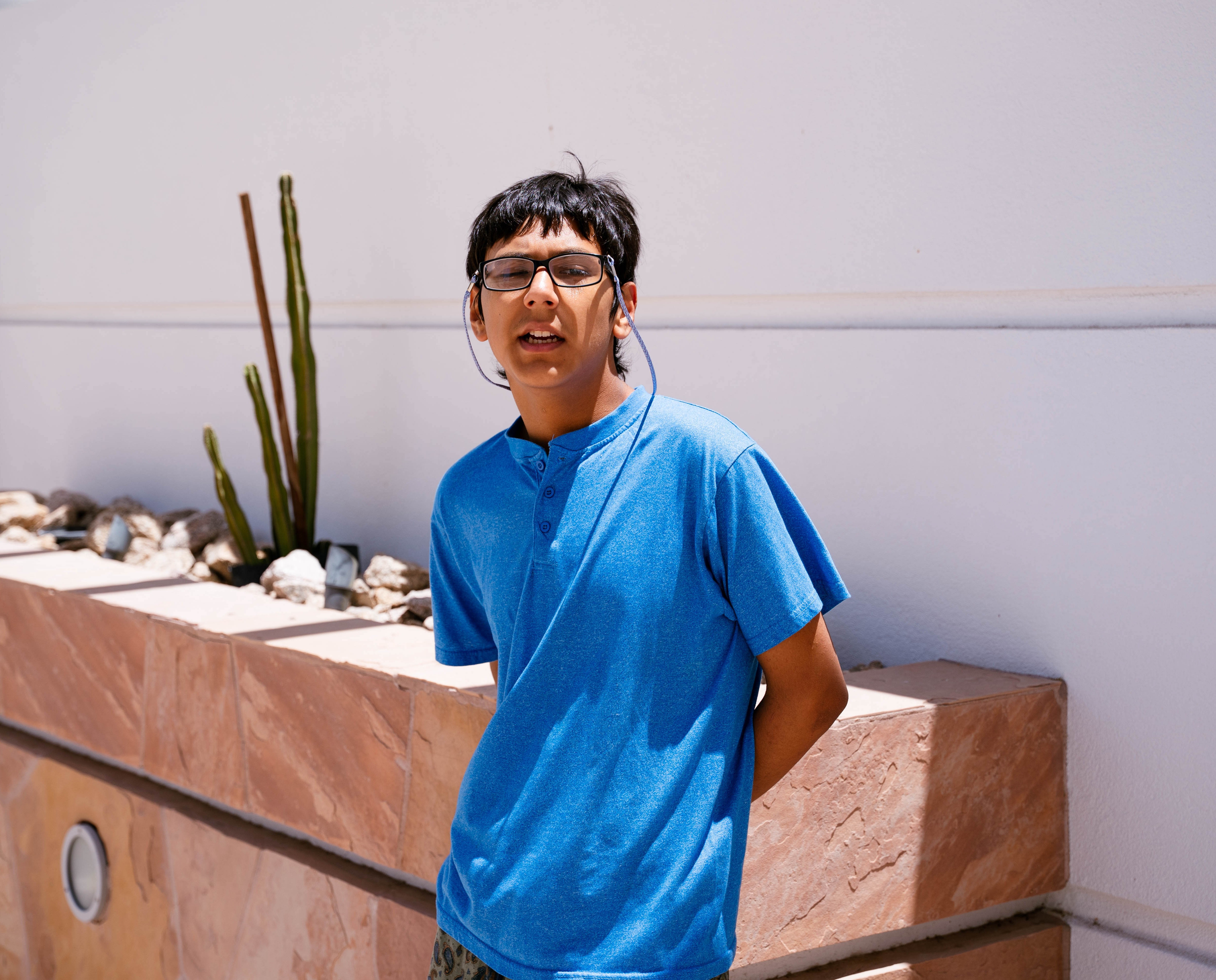 Martin standing with cactus in background