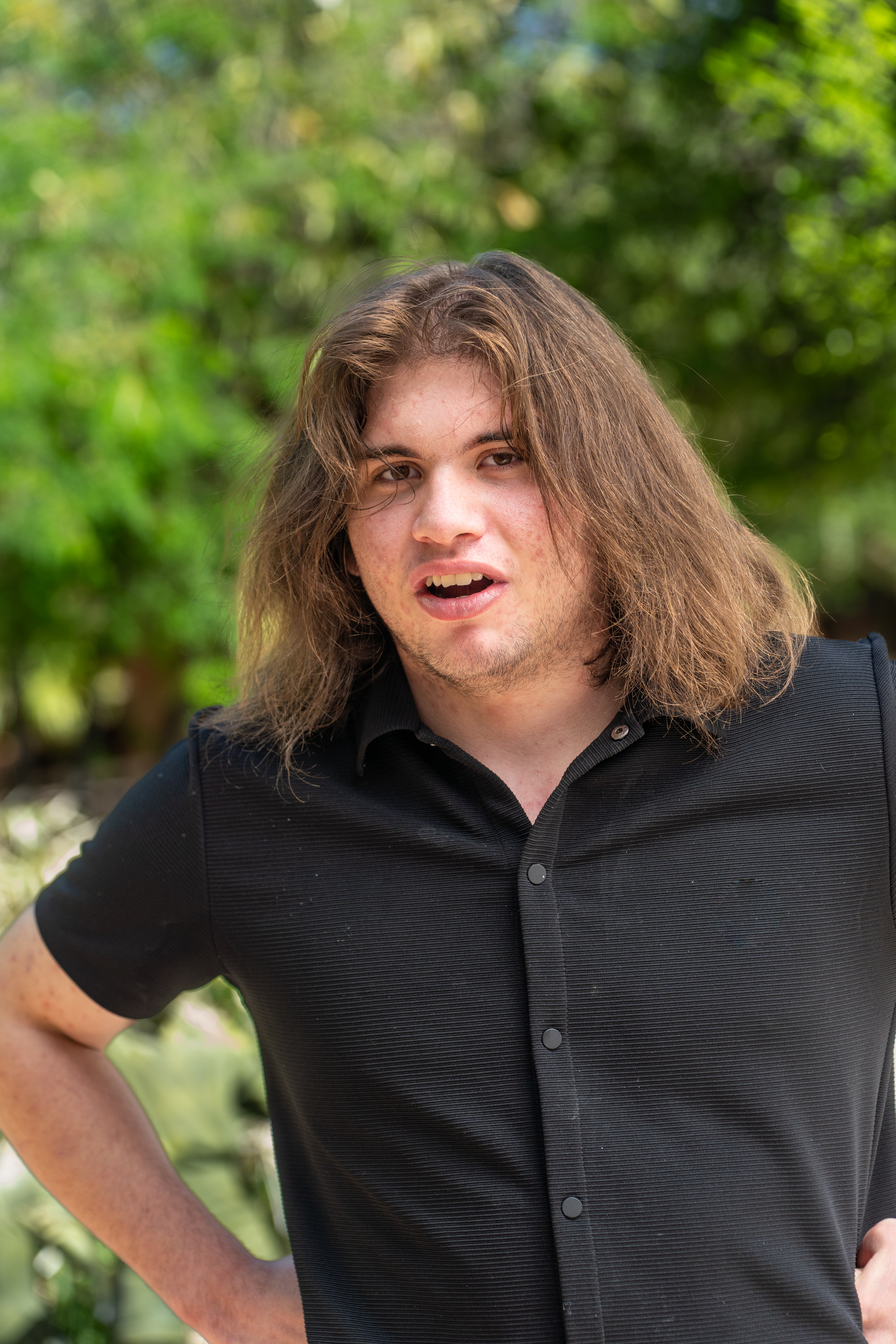 Nathan standing with hands on hips
