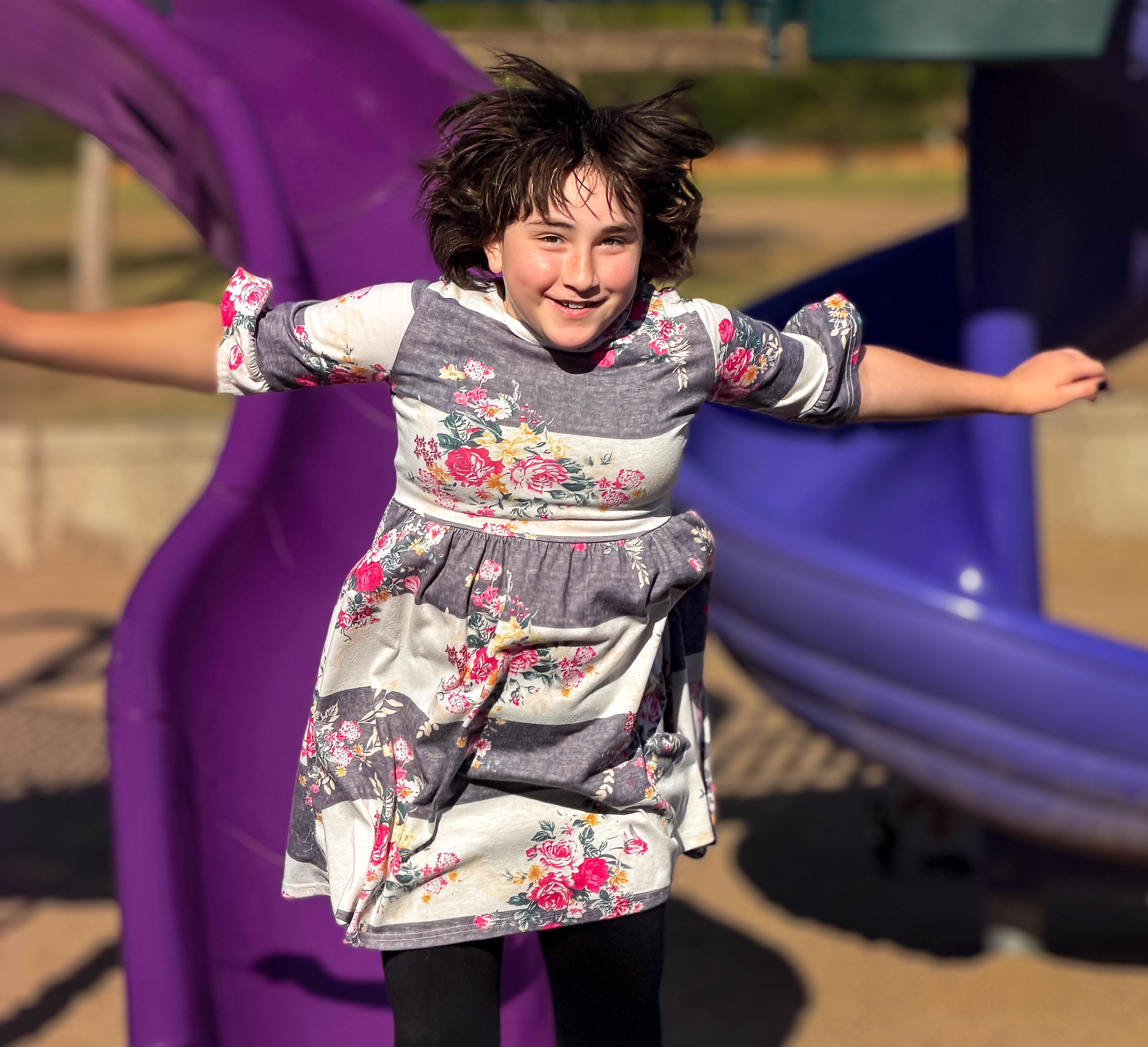 Amber jumping from slide.