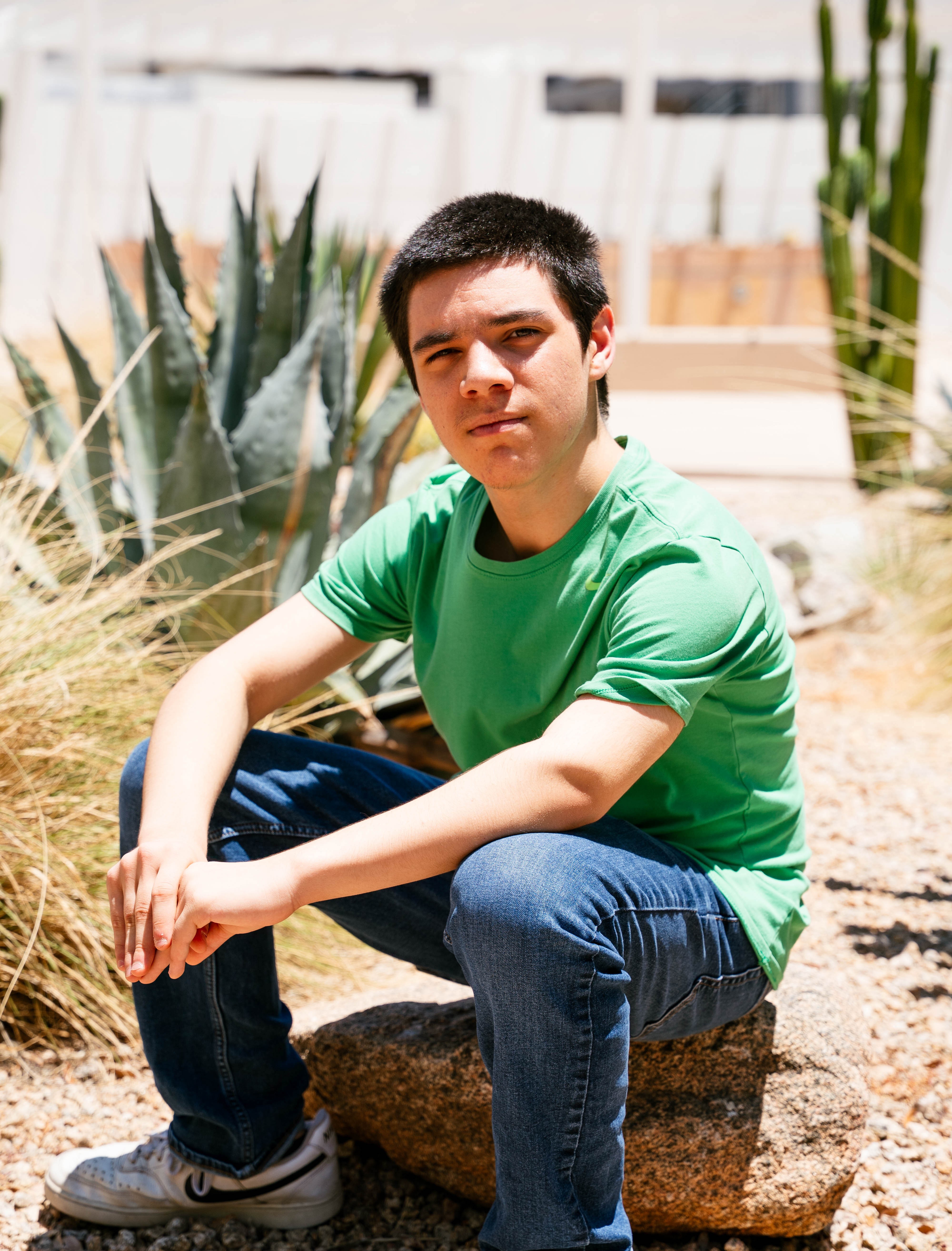 Caleb sitting on rock