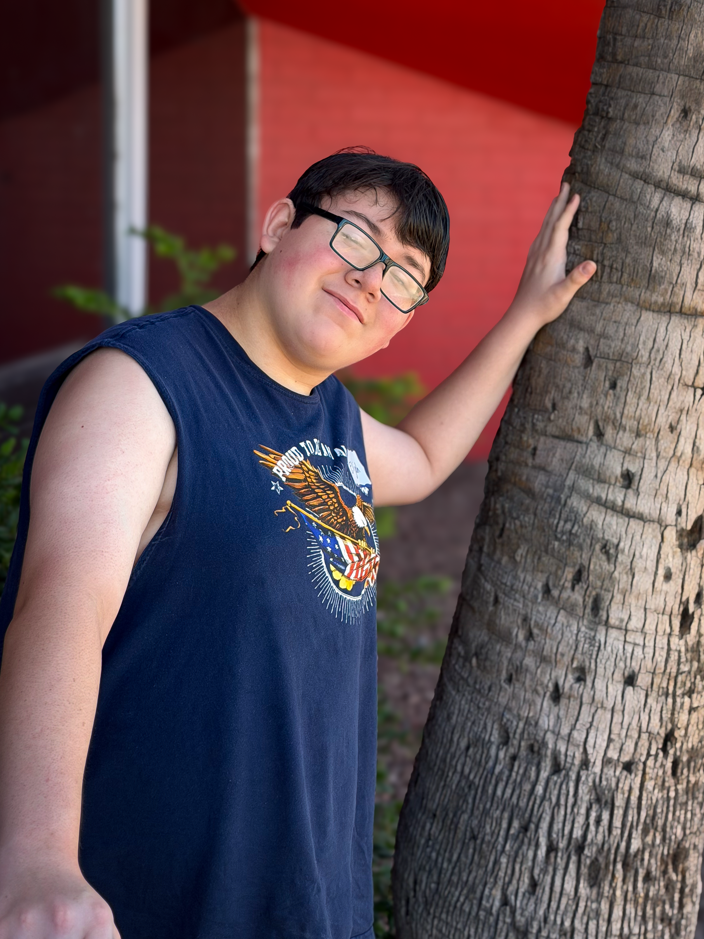 Elijah leaning on tree