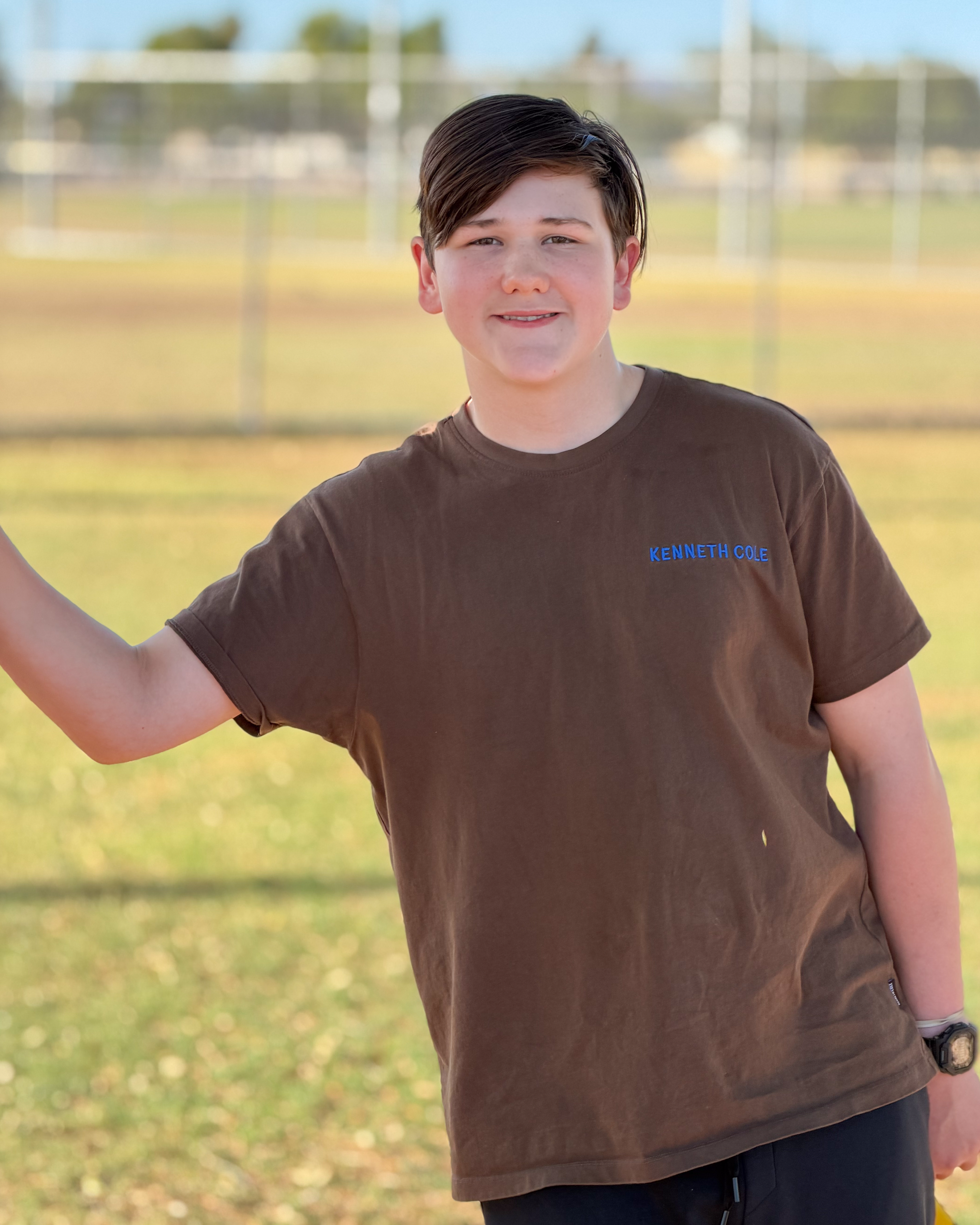 Greyson standing smiling