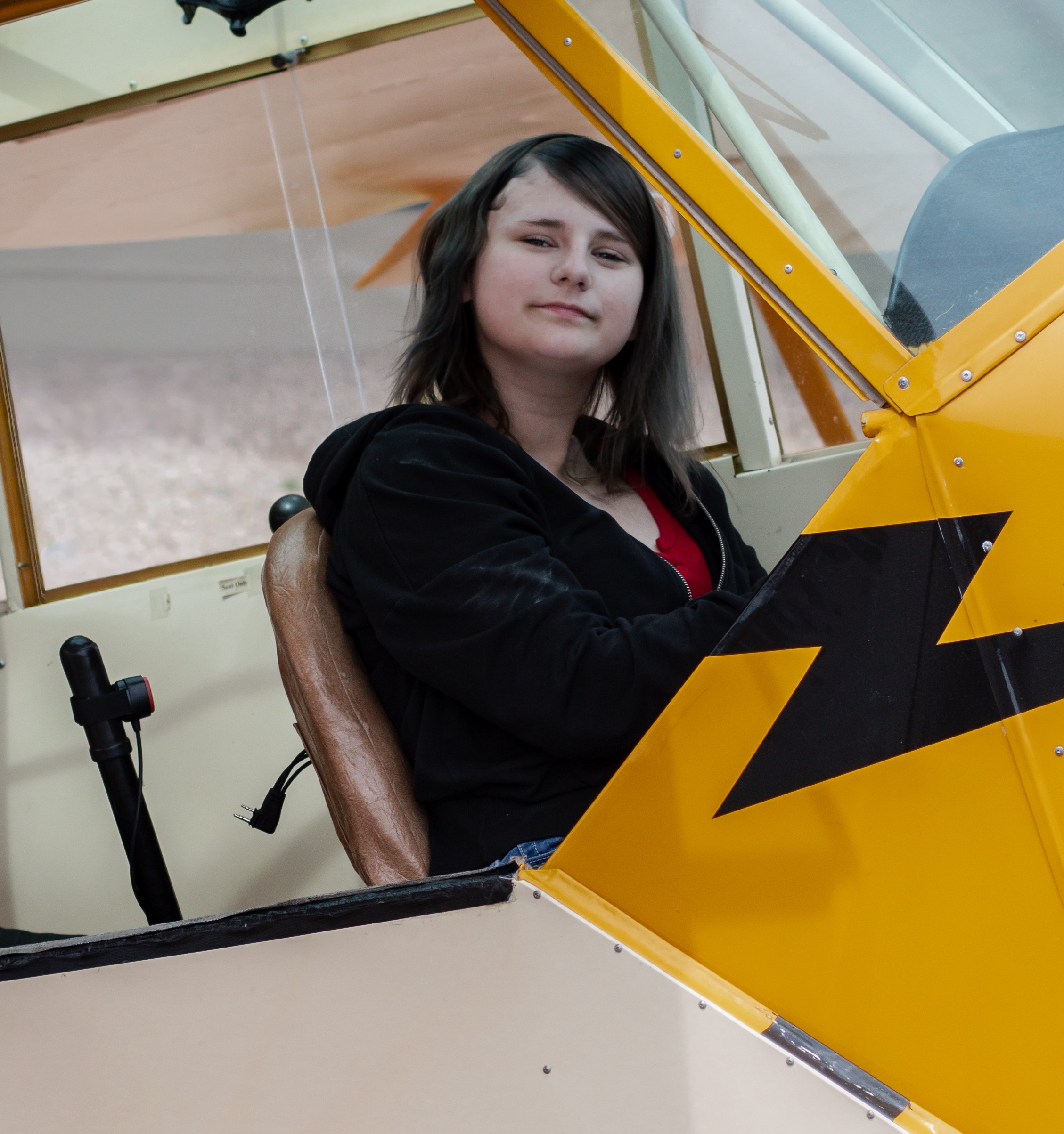 Kaylyn sitting in plane close up