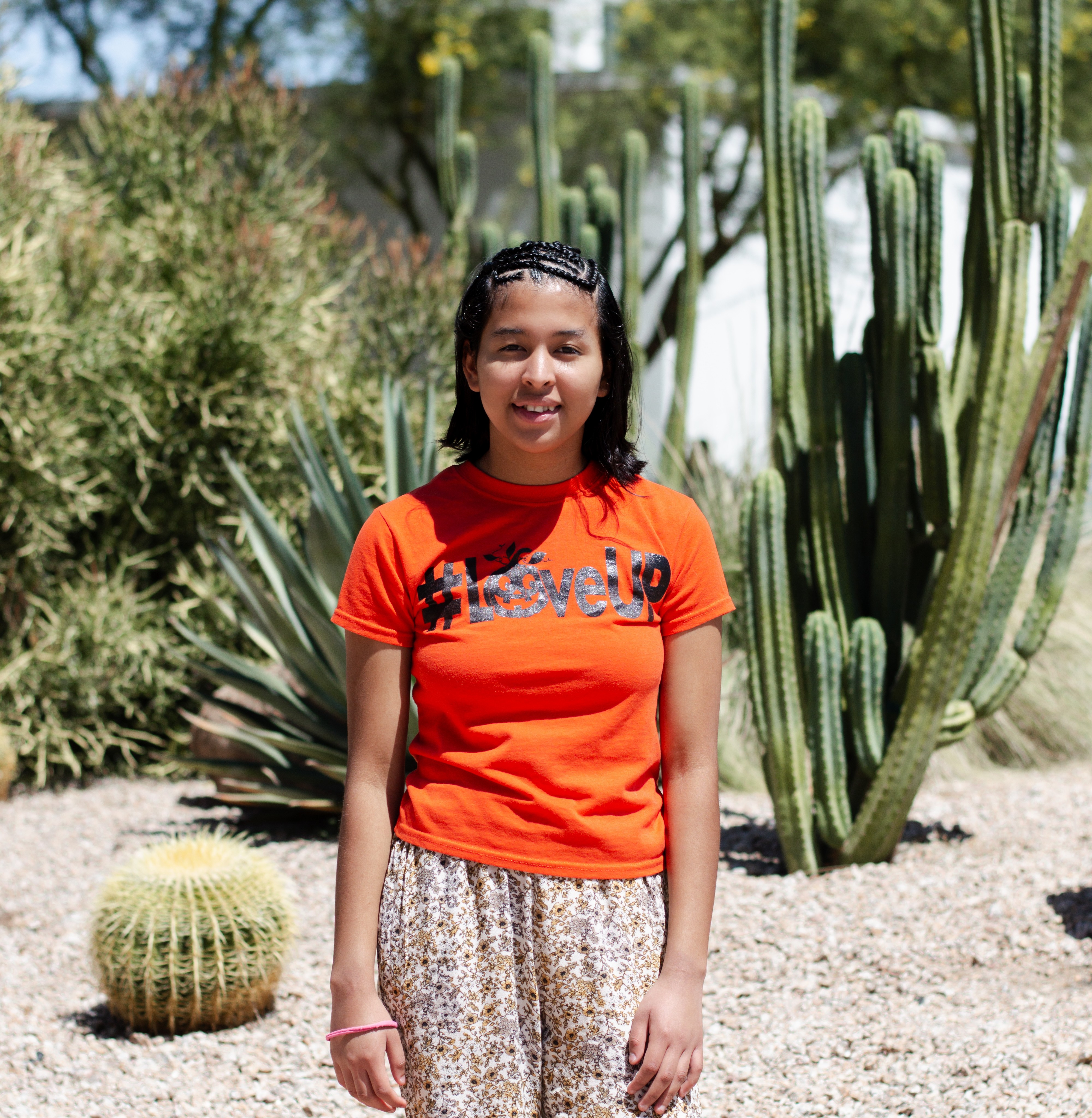 Lizbeth standing with cactus in background 