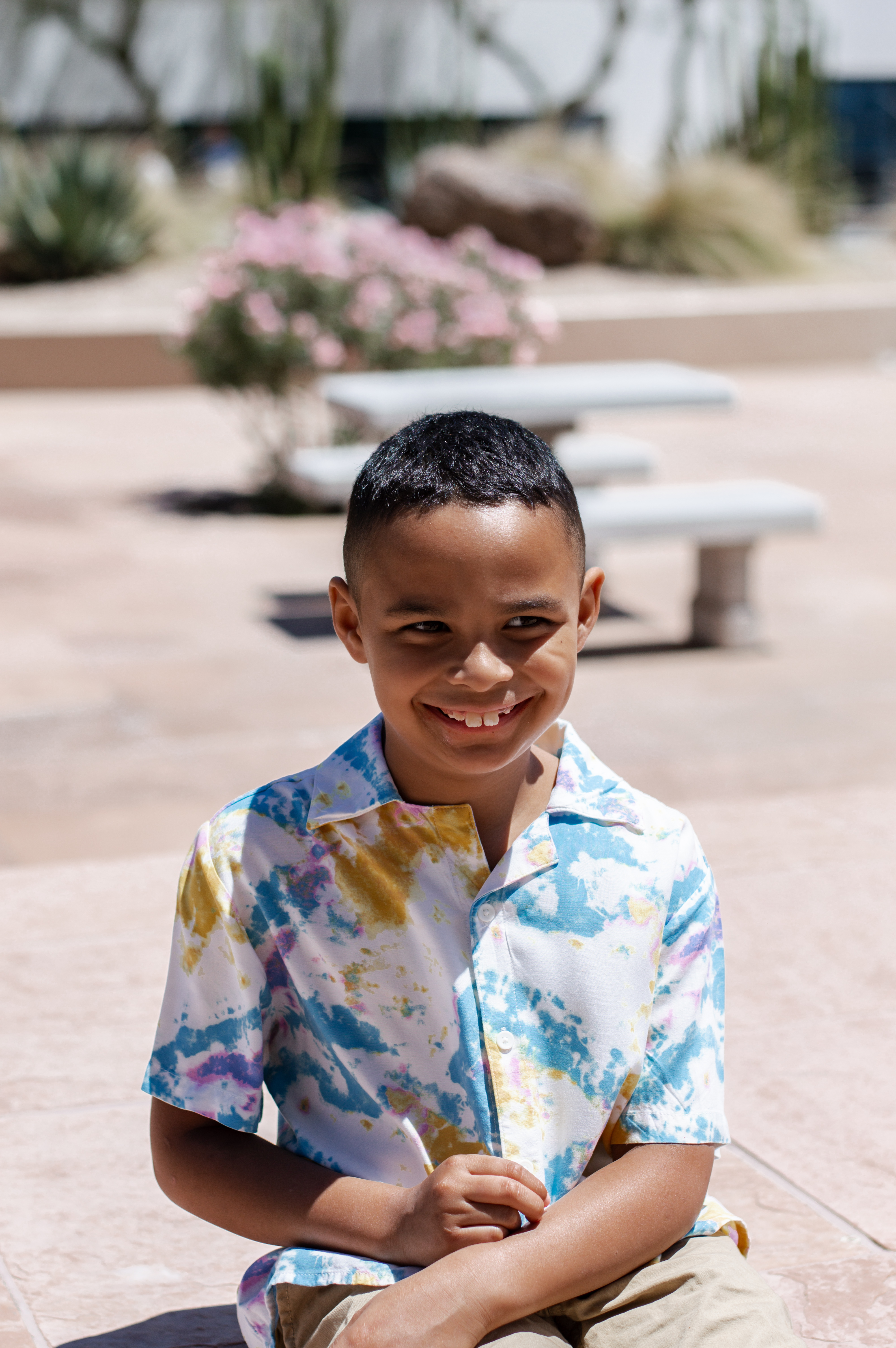 Matthew smiling with bench in background