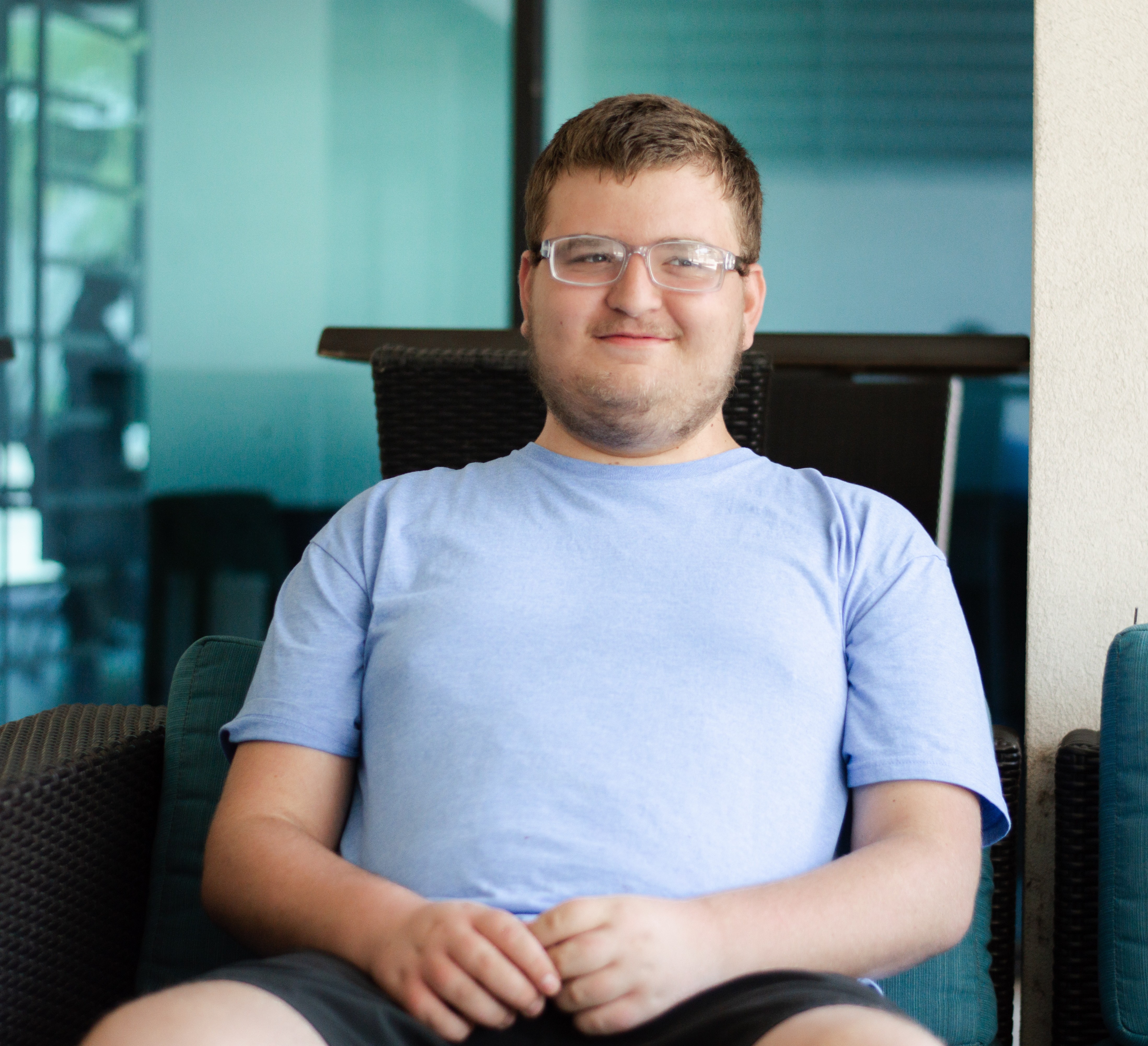Samuel sitting smiling