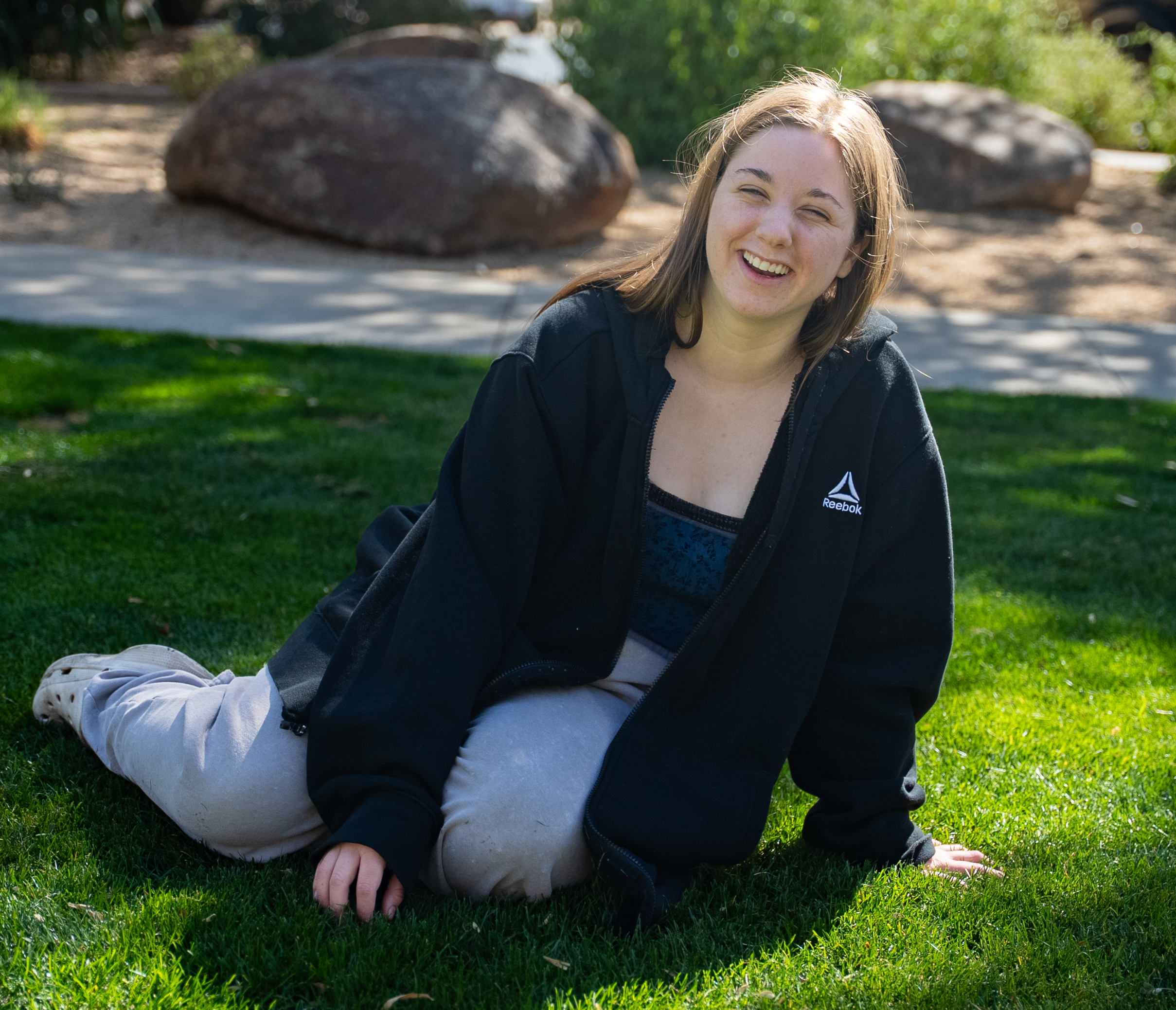 Sara sitting in grass
