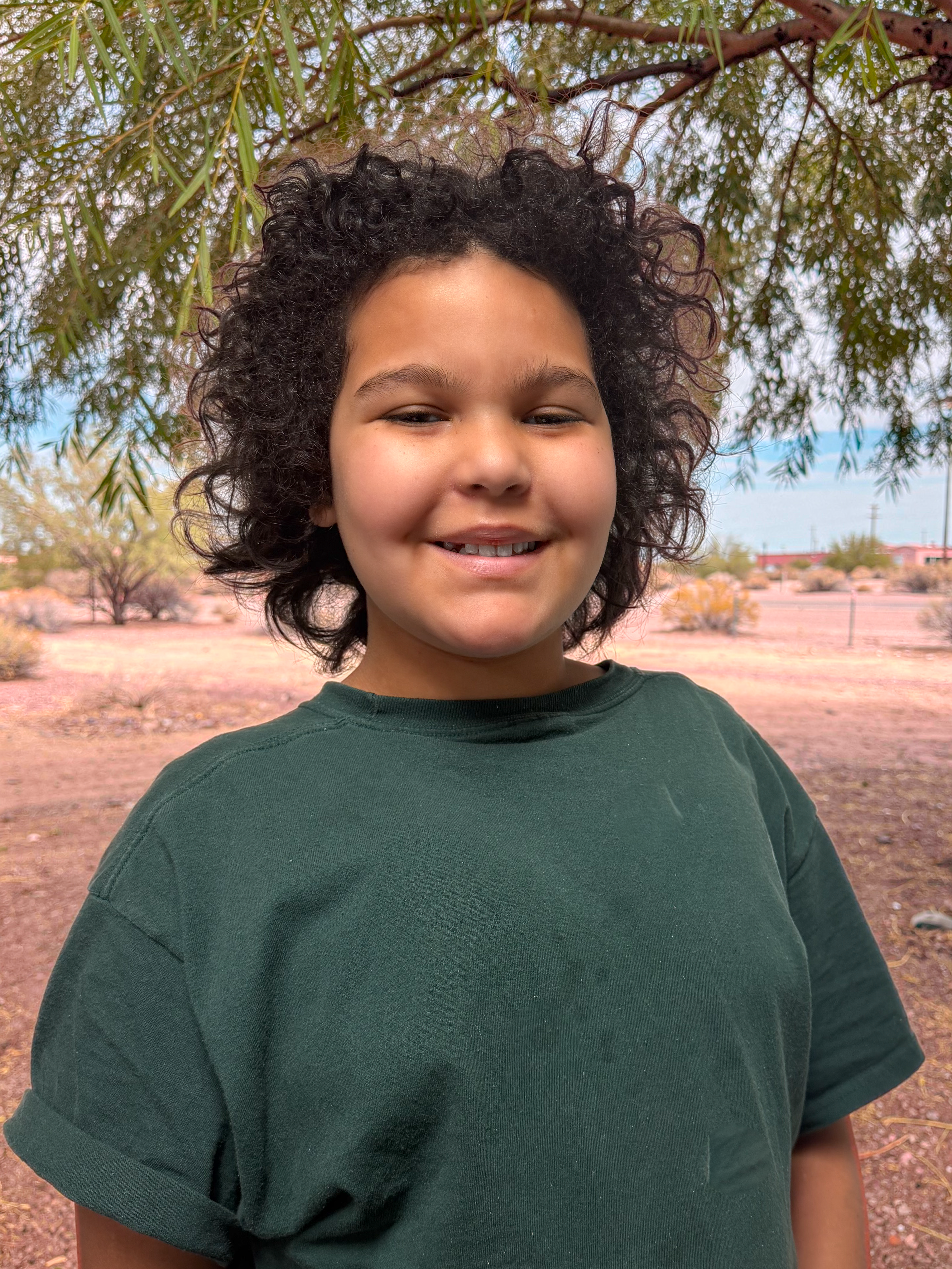 Violet smiling with tree in background