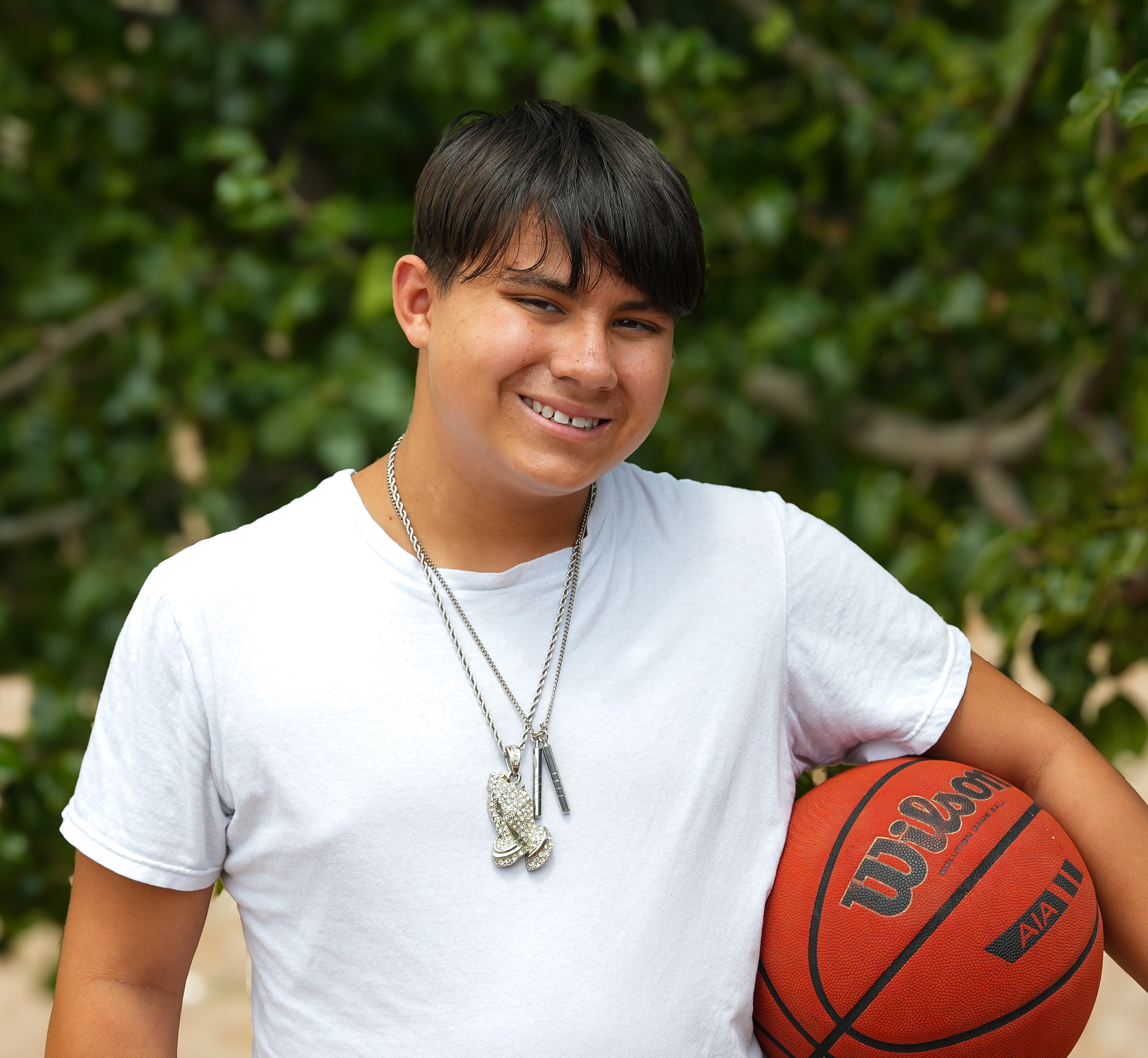 Eliejah holding a basketball
