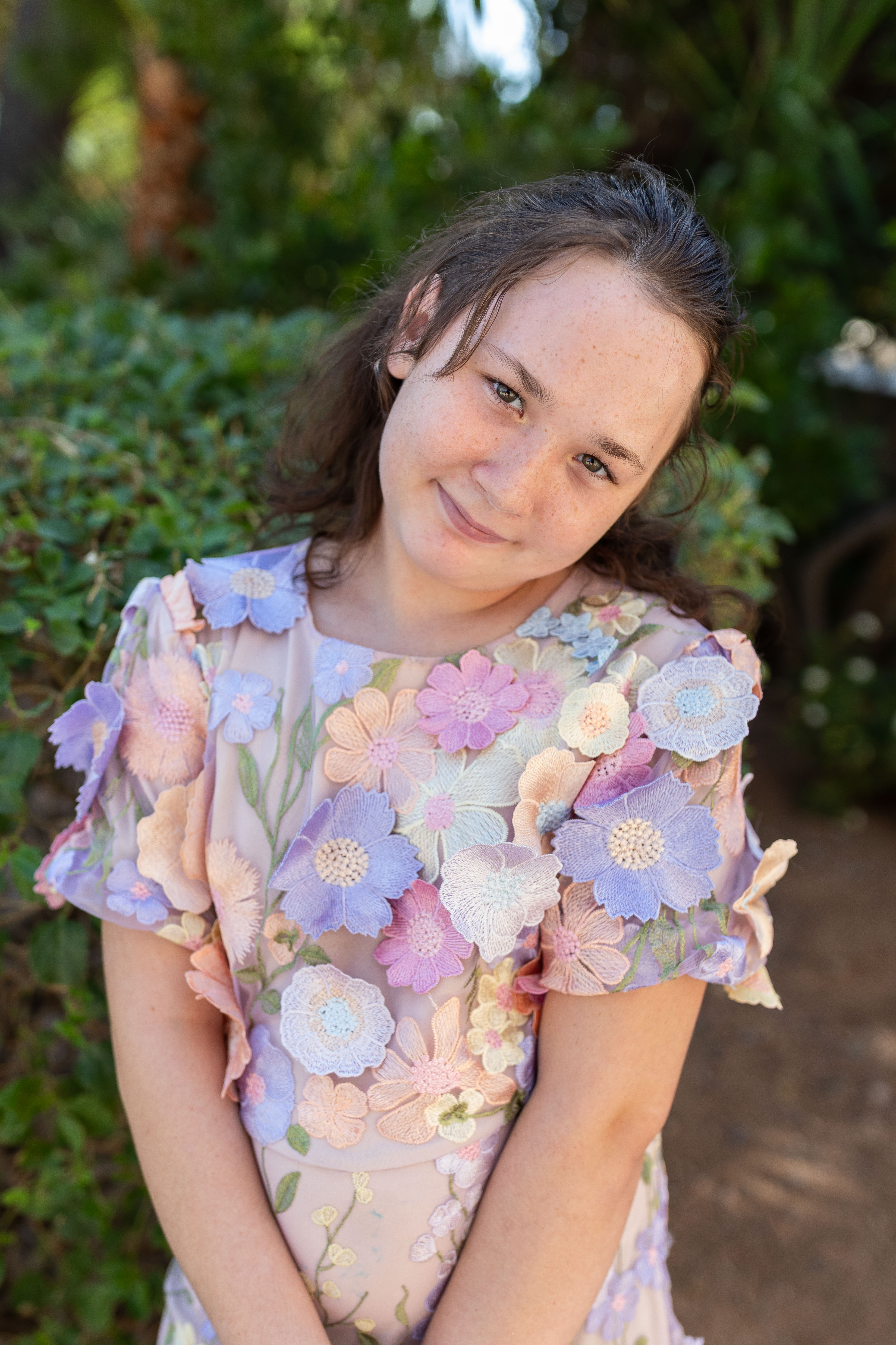 Grace posing arms in front and head to side