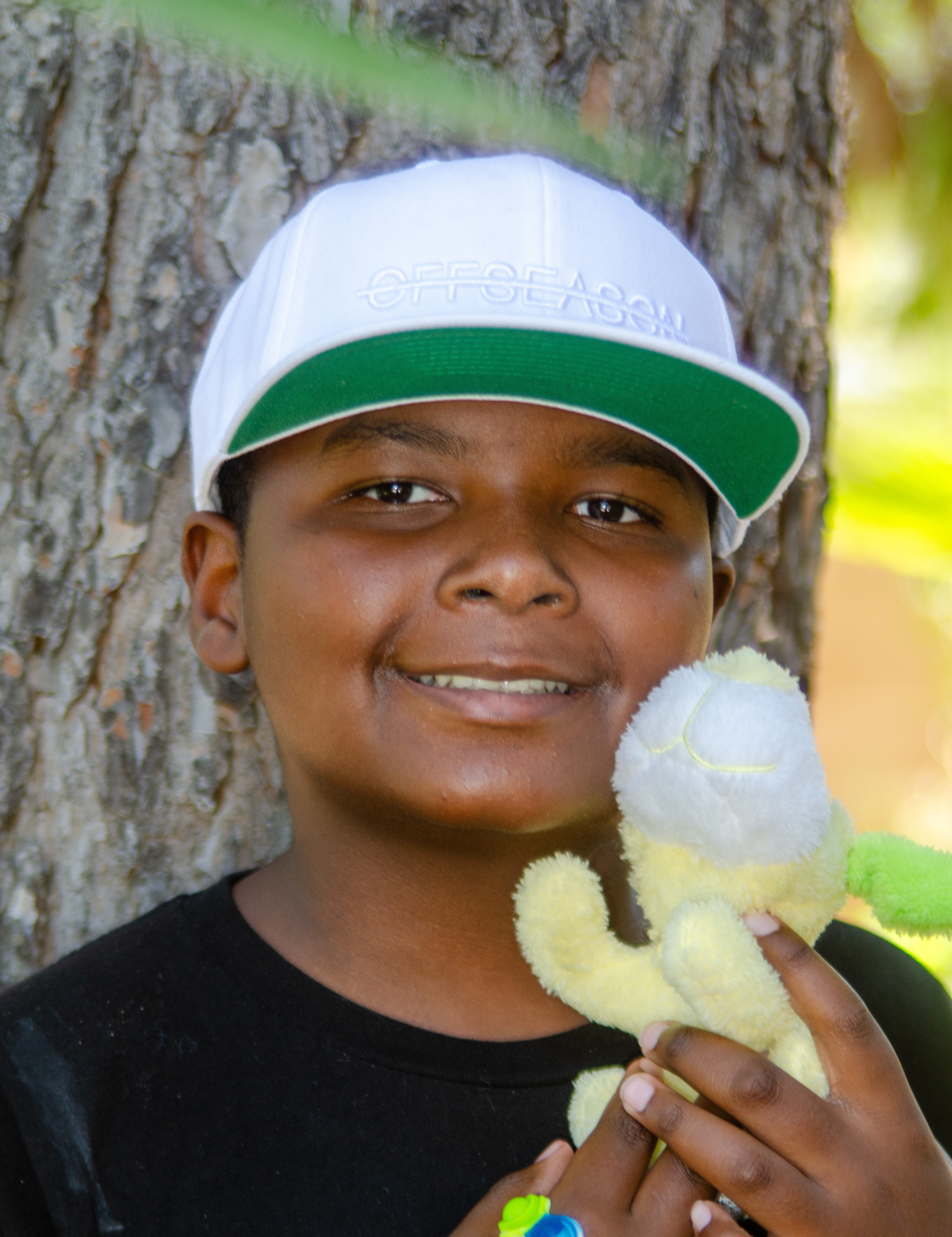 Latrell with tree in background