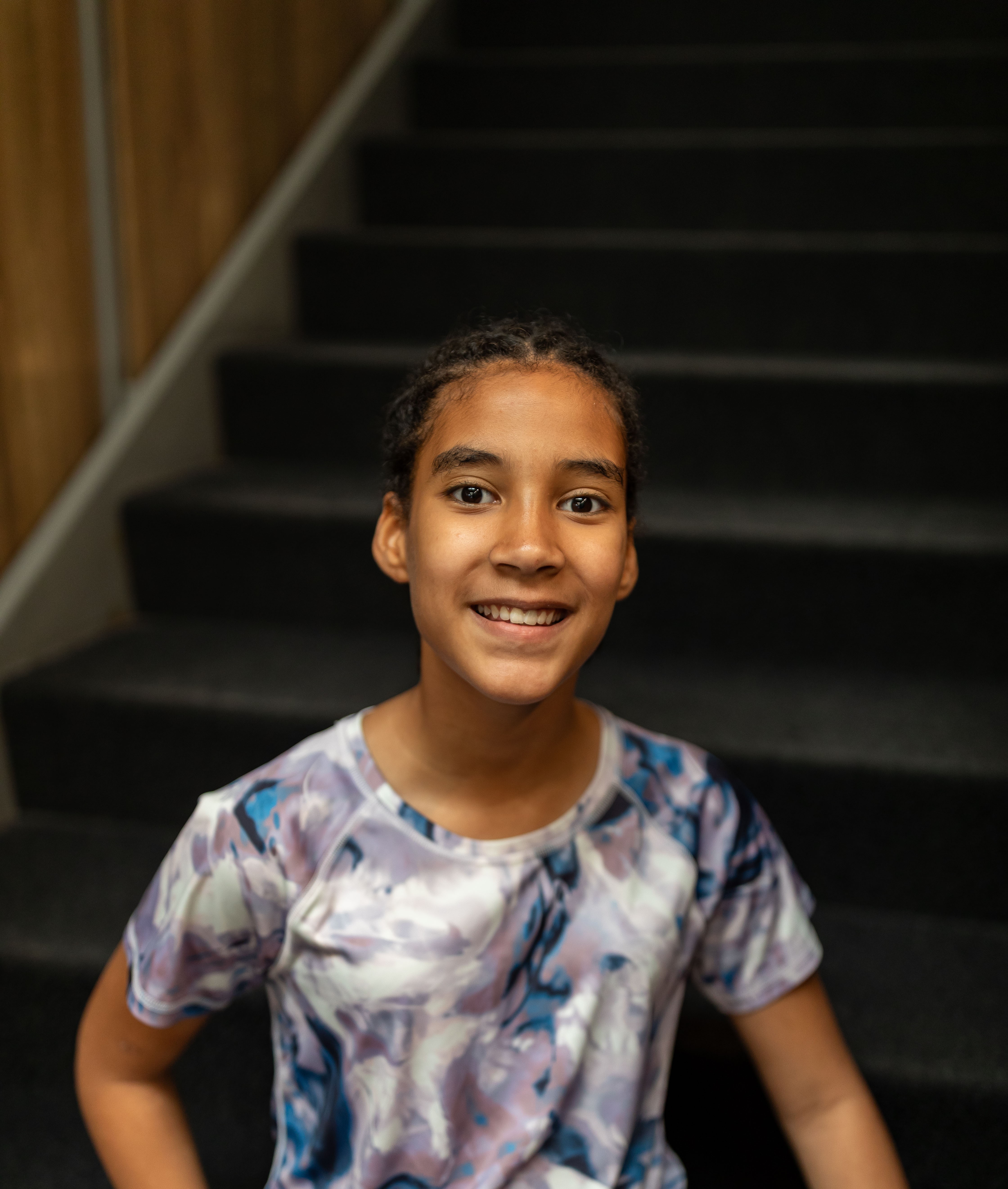 Leilani standing by stairs