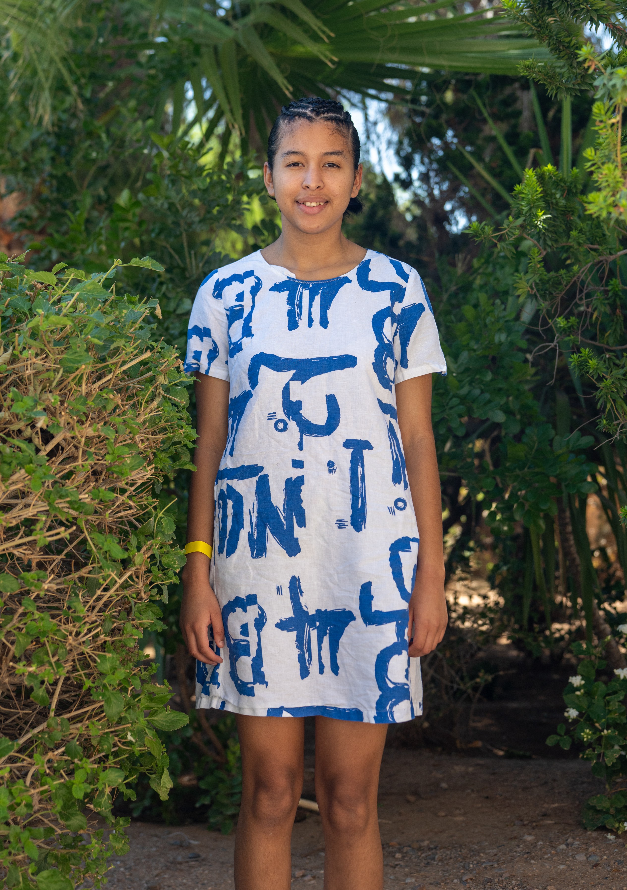 Lizbeth standing in the bushes