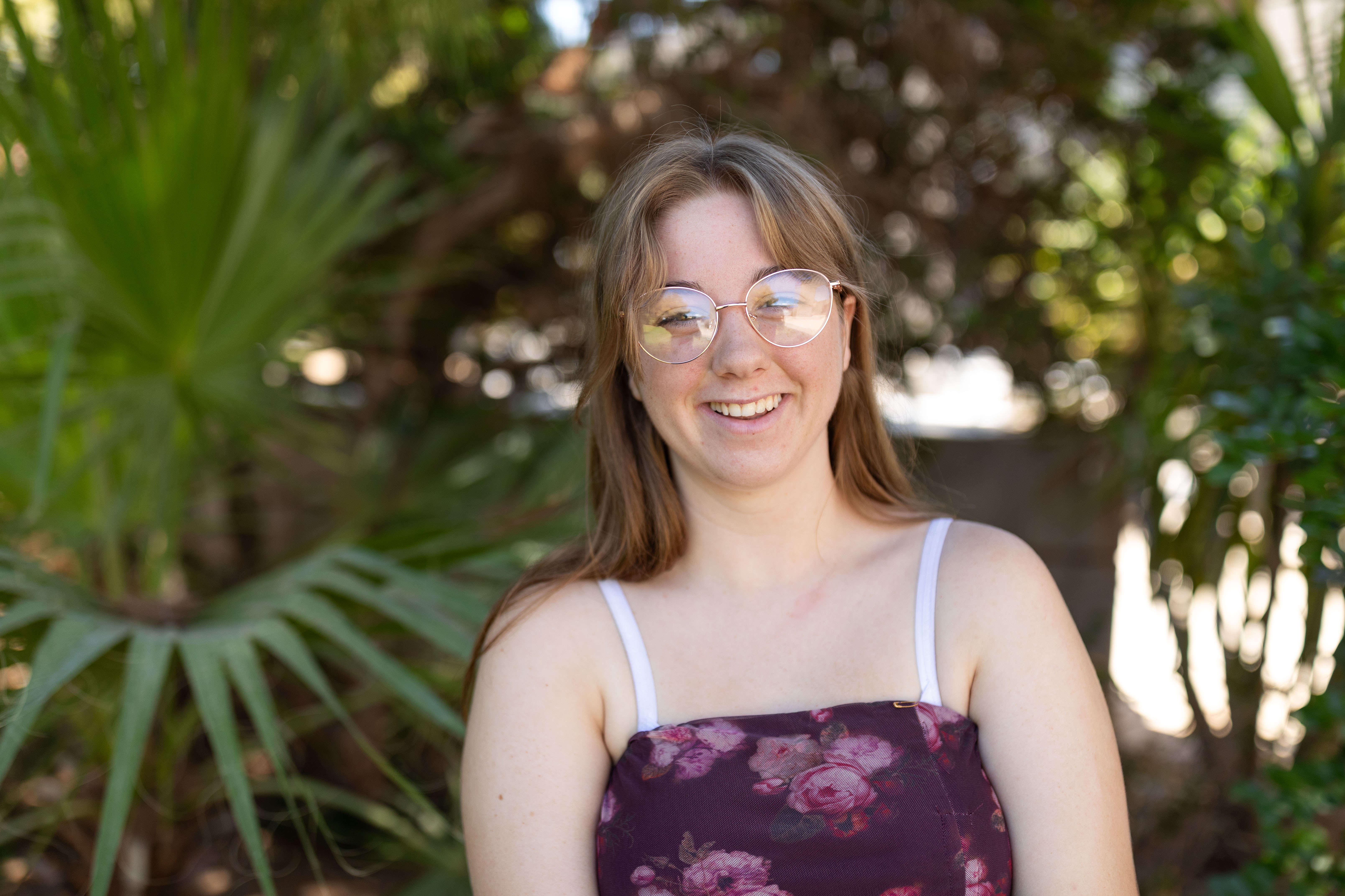 Kari smiling with trees in background