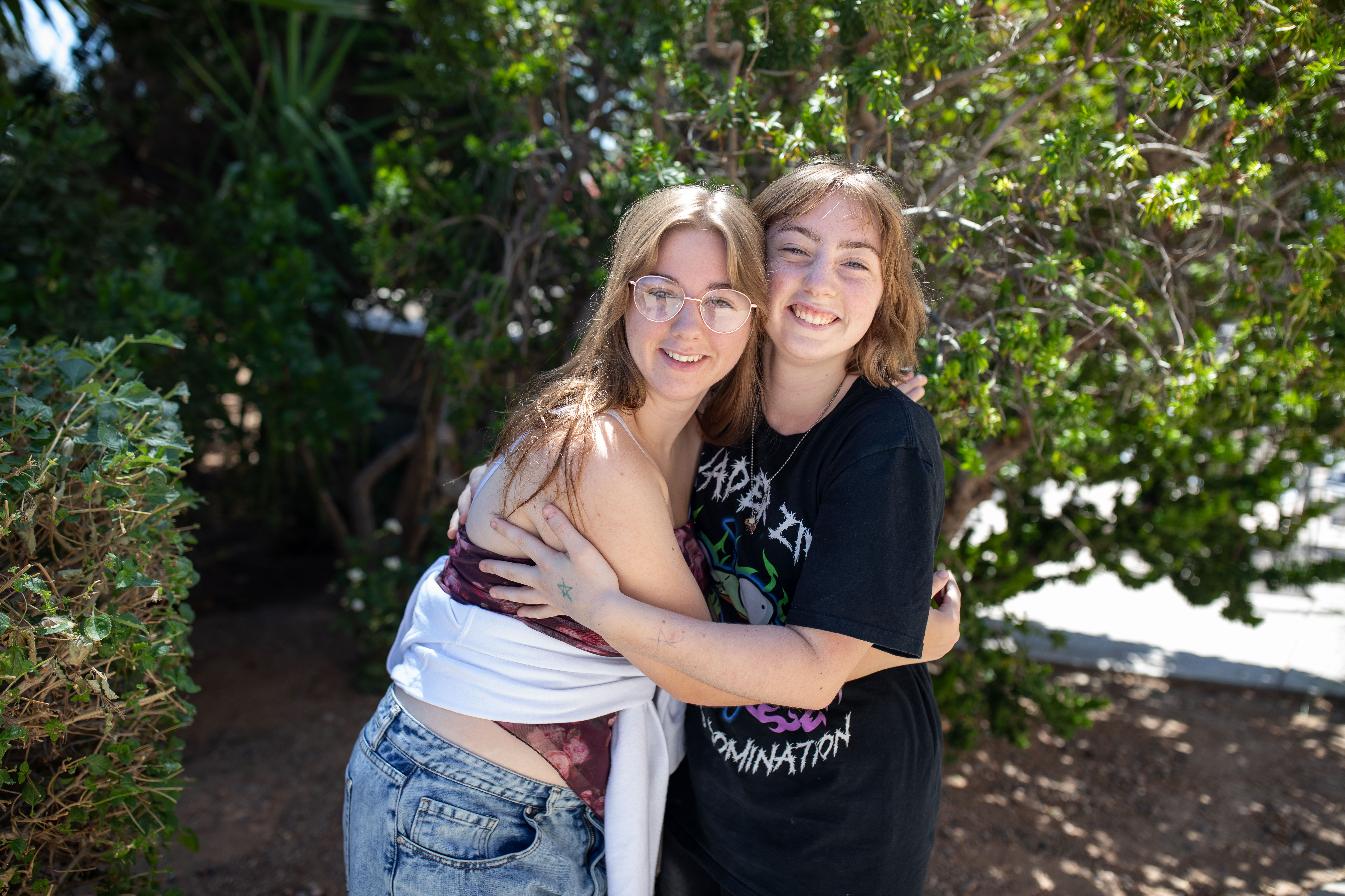 Kari and Sara holding each other