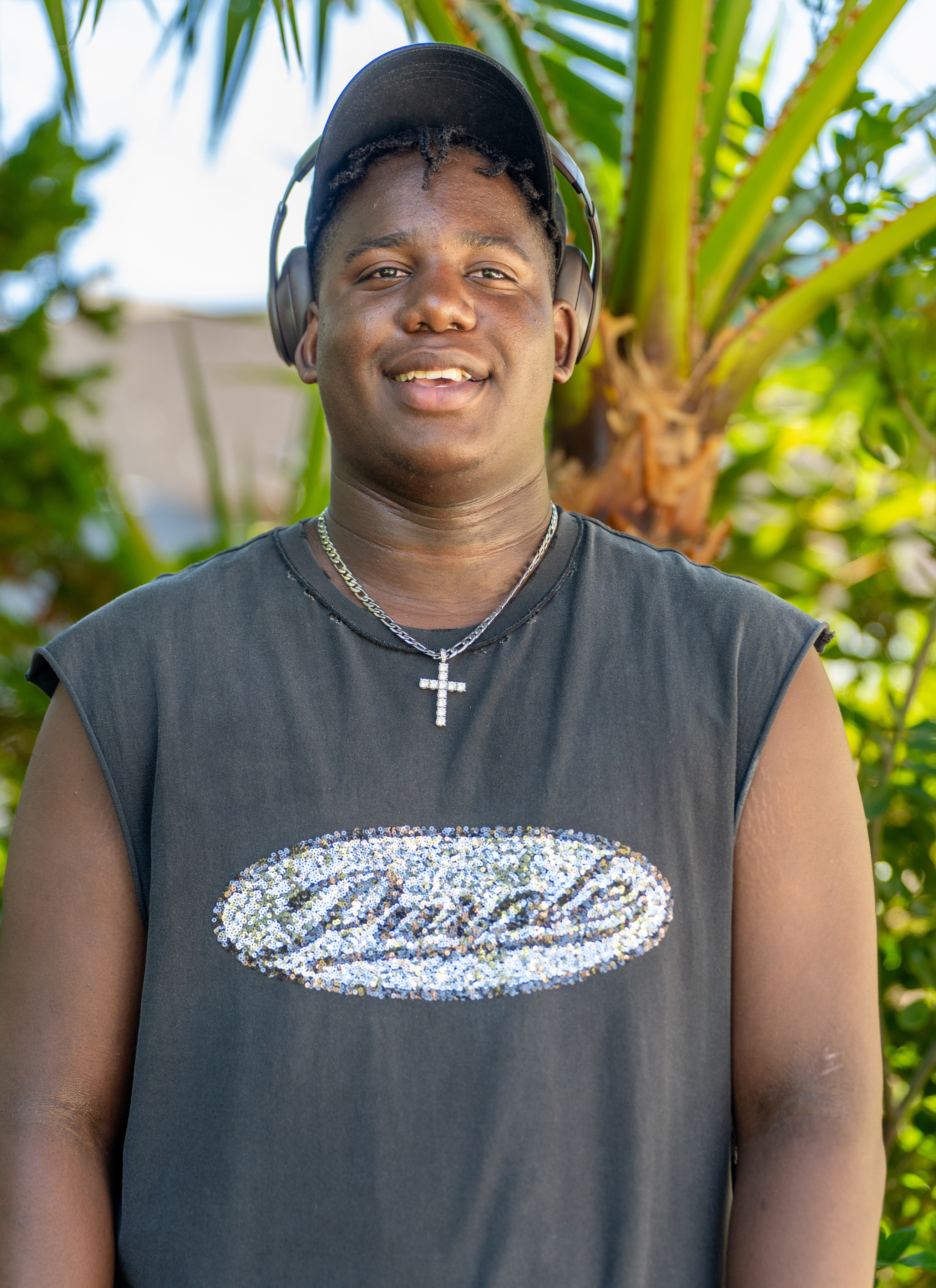 Chauncey with palm tree behind