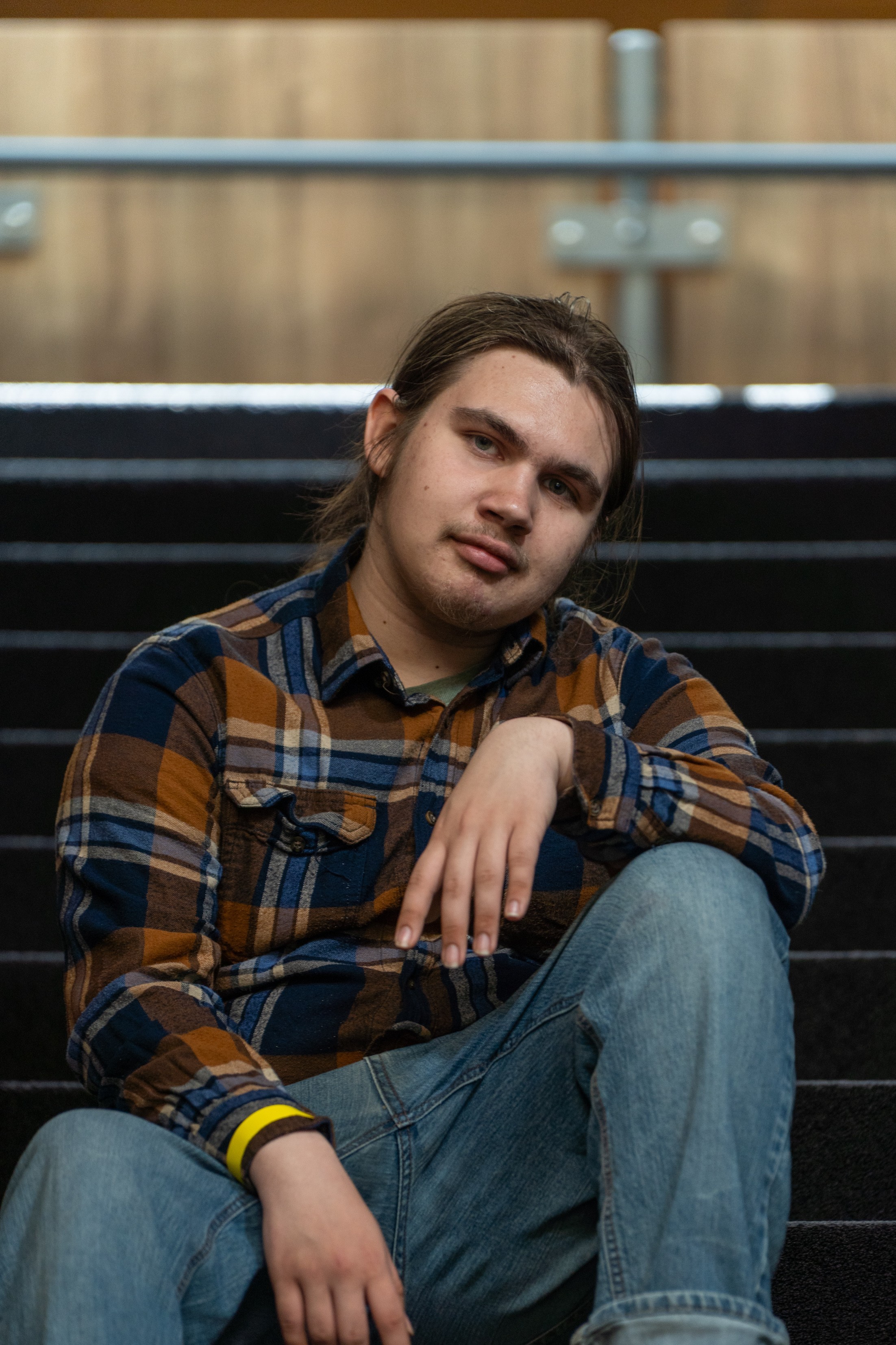 Ivanking sitting on steps with head sideways