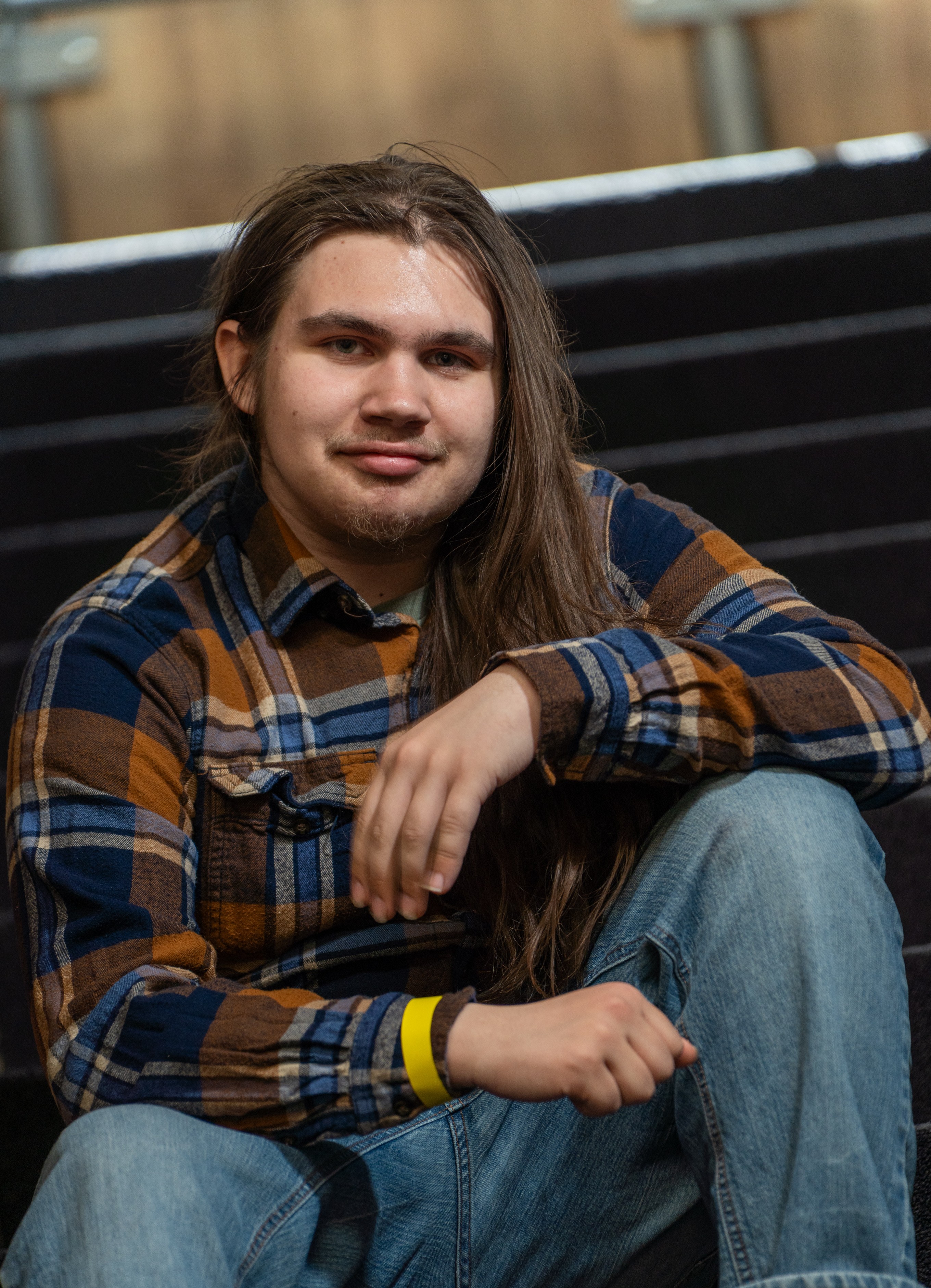 Ivanking sitting on stairs with arms on knee