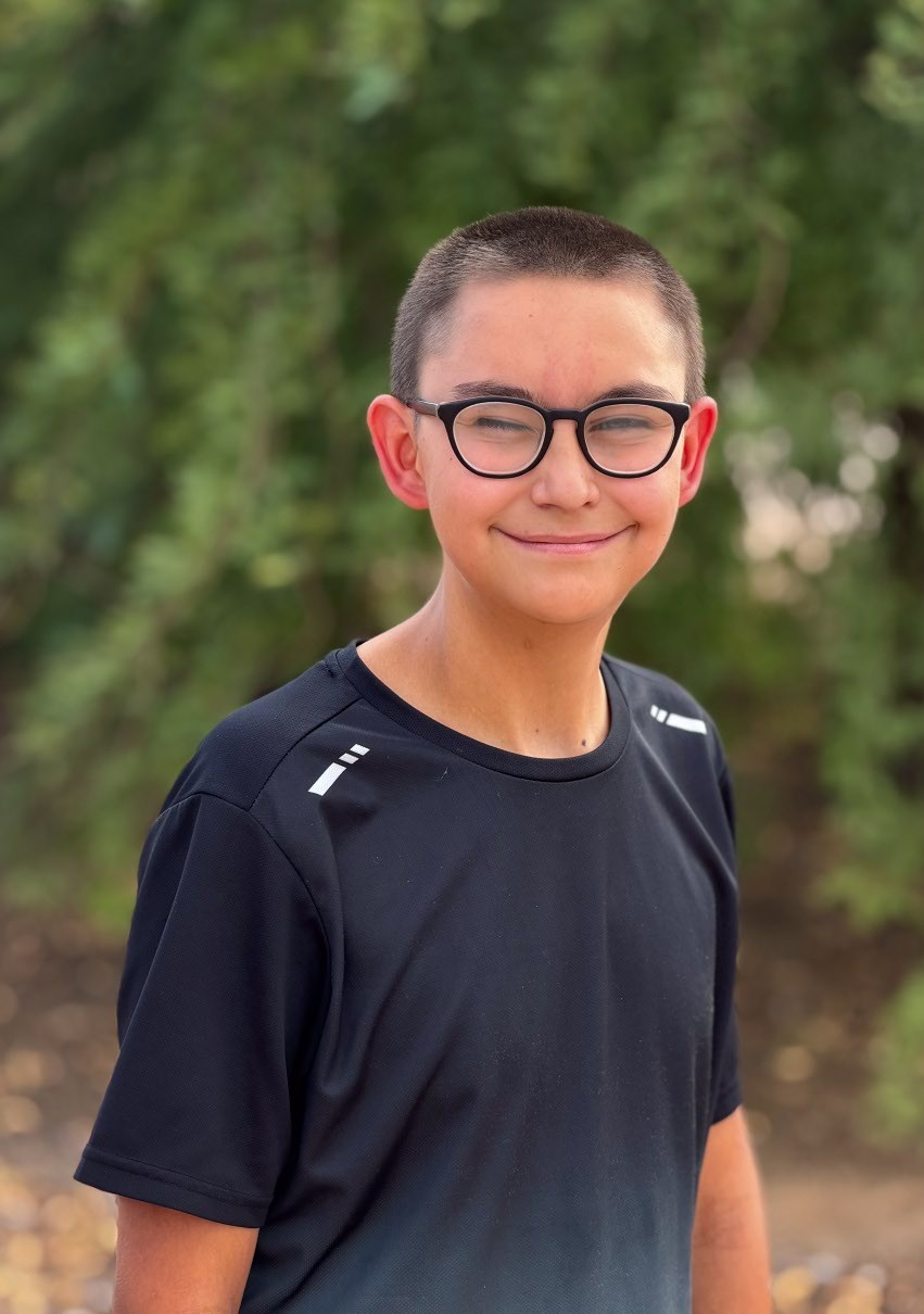 Jacob smiling with trees in background