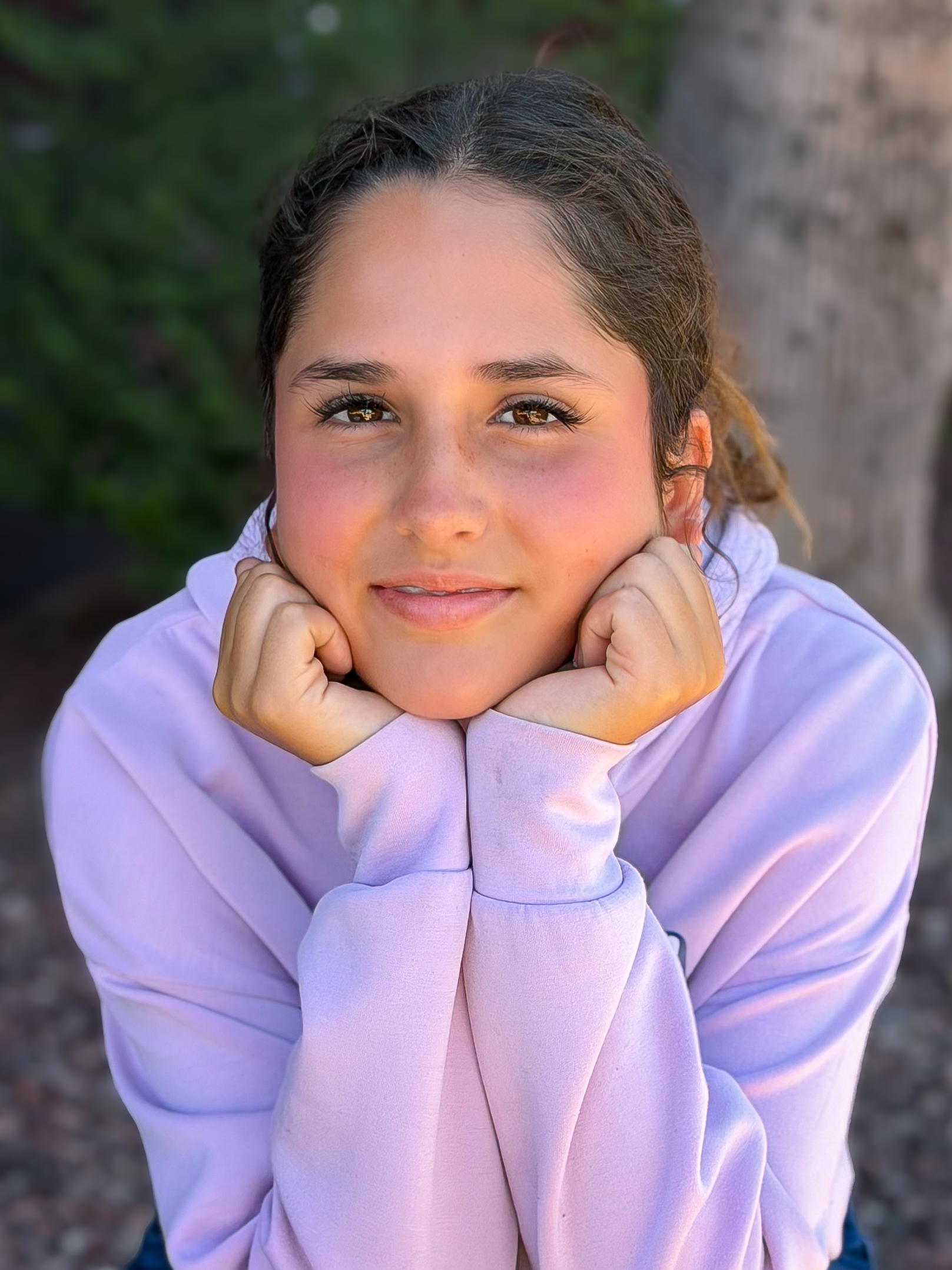 Cecilia with hands on face