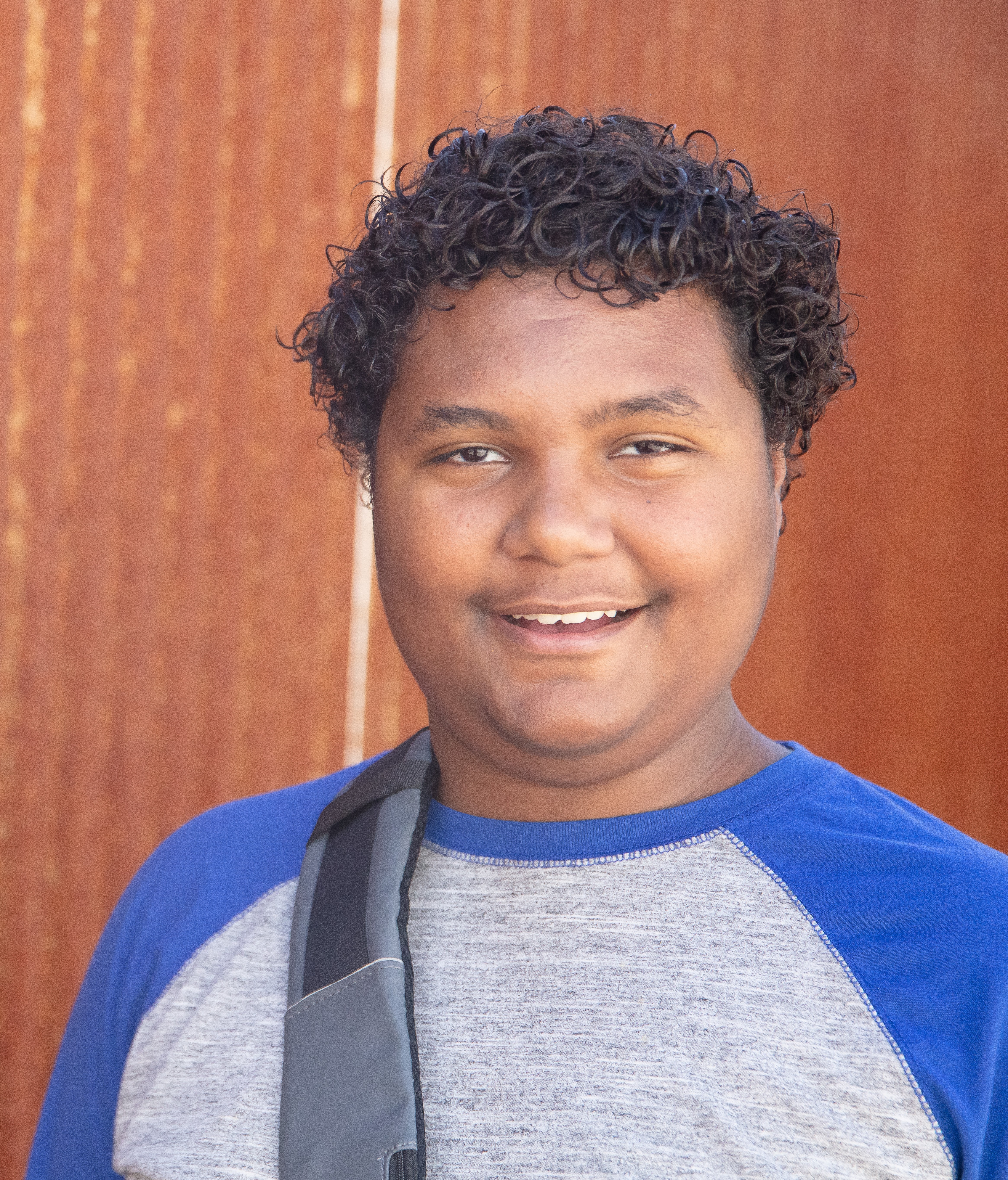 Xavier (1)smiling with brown wall in background