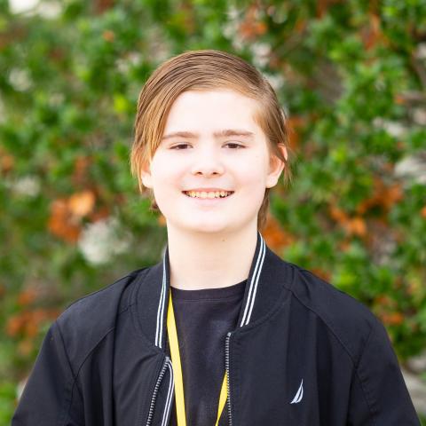 Ethan head shot with bush in background