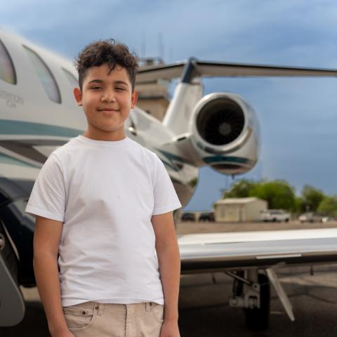 Victor standing next to plane
