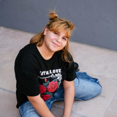 Valeria sitting on ground