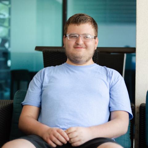 Samuel sitting smiling