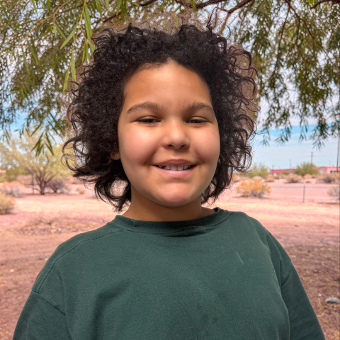 Violet smiling with tree in background