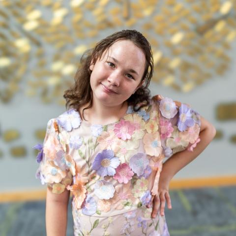 Grace standing with hand on hip 