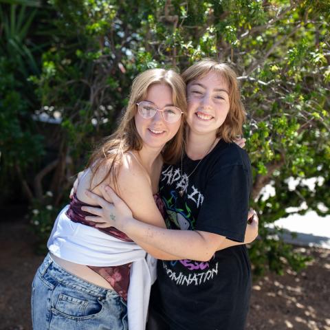 Kari and Sara holding each other
