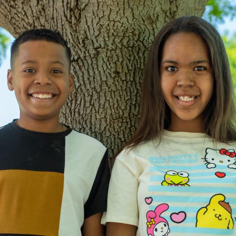 Rayne and Skylar by tree