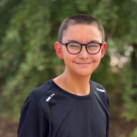Jacob smiling with trees in background