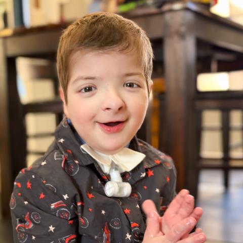Kayson smiling clapping
