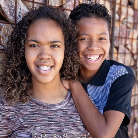 Rayne and Skylar with rock wall in background